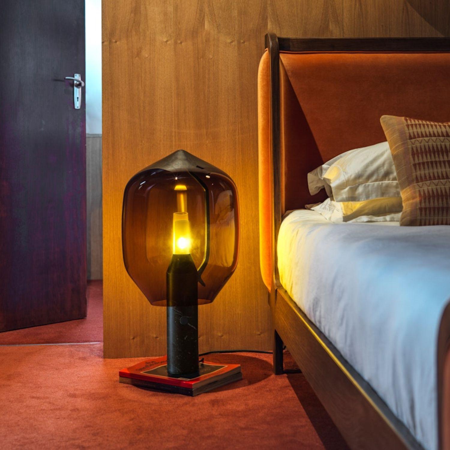 'Lighthouse’ Table Lamp in Black Marble and Grey Glass for Established & Sons

An elegant equation of modern and traditional craftsmanship, the 'Lighthouse' balances a Venetian mouth blown glass shade on an industrially engineered aluminum arm,