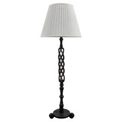Lighting - African ebony table lamp with recessed lights.