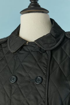 Lightly quilted black double breasted jacket with Tartan lining Burberry London