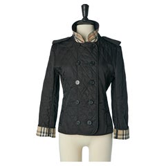 Lightly quilted black double breasted jacket with Tartan lining Burberry London