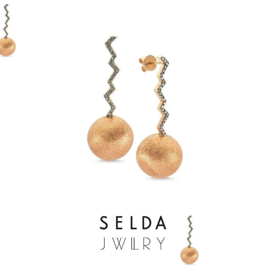 Lightning ball earrings with full white diamond & rose gold by Selda Jewellery

Additional Information:-
Collection: Thunder Collection
14k Rose gold
0.26ct White diamond
Height 4cm