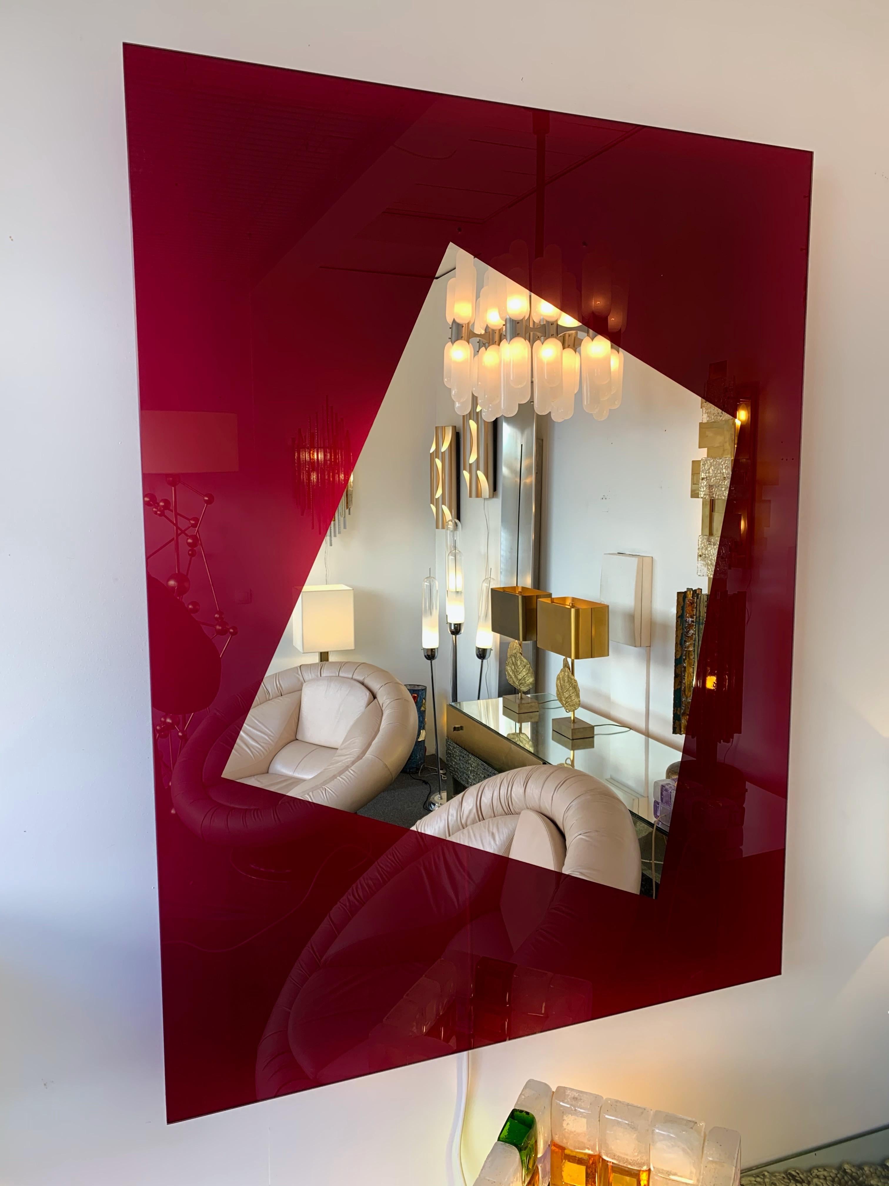 Wall mirror in magenta tempered lightning glass, work with a light box on the back. by the designer Nanda Vigo for the manufacture Glass Italia. Produced in 2008, out of production today. This version is a prototype never edited, come with a