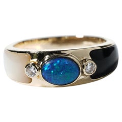 Anello Lightning Ridge in oro 14K con opale nero, diamante, onice e madreperla