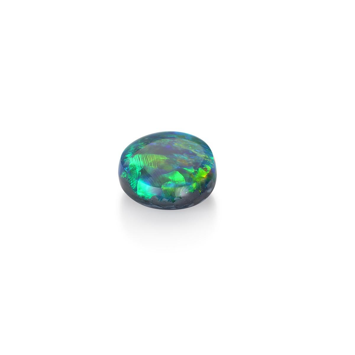 Spectacular in color and shape and exhibiting a stunning range of colors, this 4.75 carat natural black opal is a gem-quality stone for the avid collector or jewelry lover. 

Unlike ordinary opals, black opals have carbon and iron oxide trace