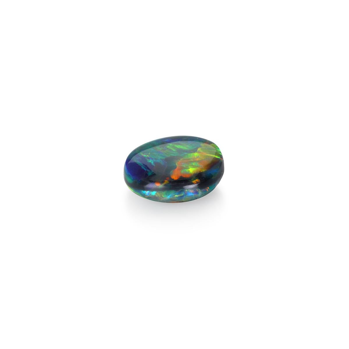 Spectacular in color and shape and exhibiting a stunning range of colors, this 2.80 carat natural black opal is a gem-quality stone for the avid collector or jewelry lover. 

Unlike ordinary opals, black opals have carbon and iron oxide trace