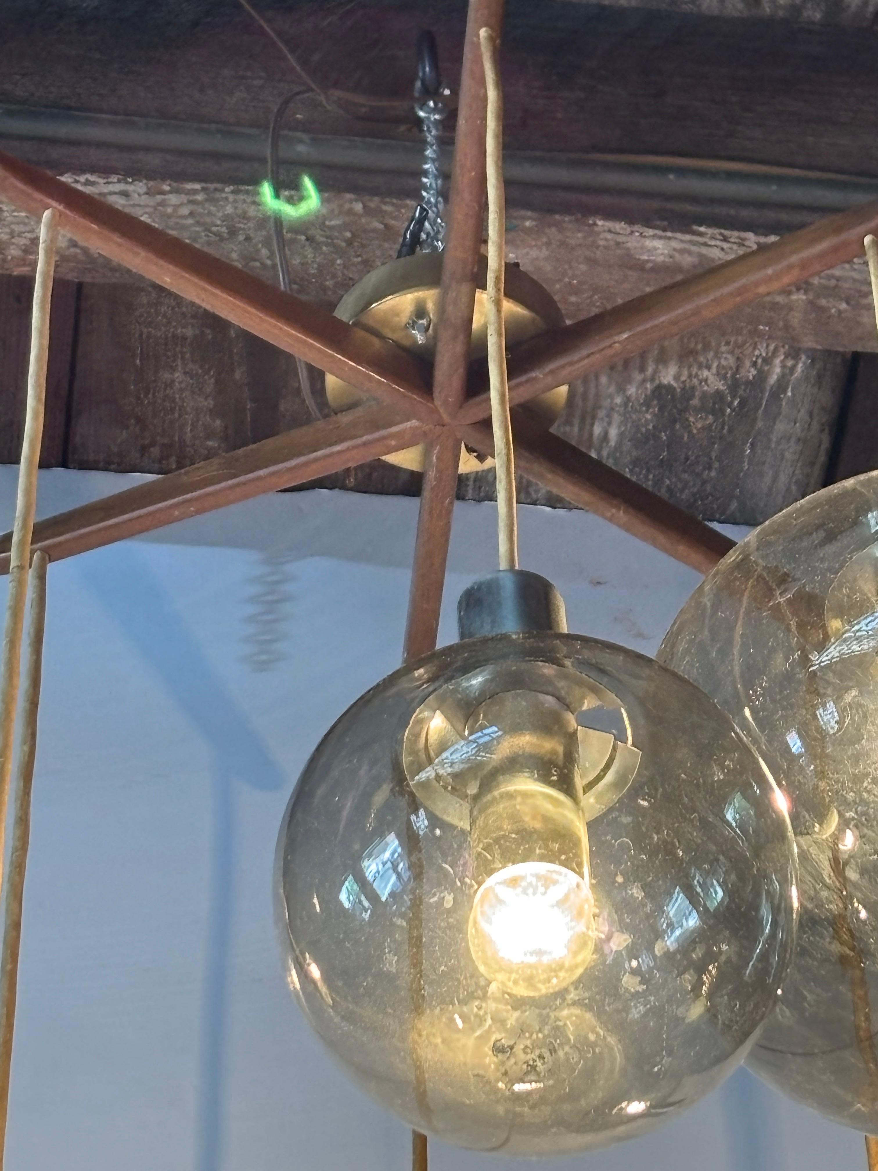 Lightolier 6 Globe Hanging Fixture.  Adjustable cords can make this fixture hang shorter as well!  Smoked Glass Shades in nice shape!  Wood spoke design fitter flush-mounts to the ceiling.