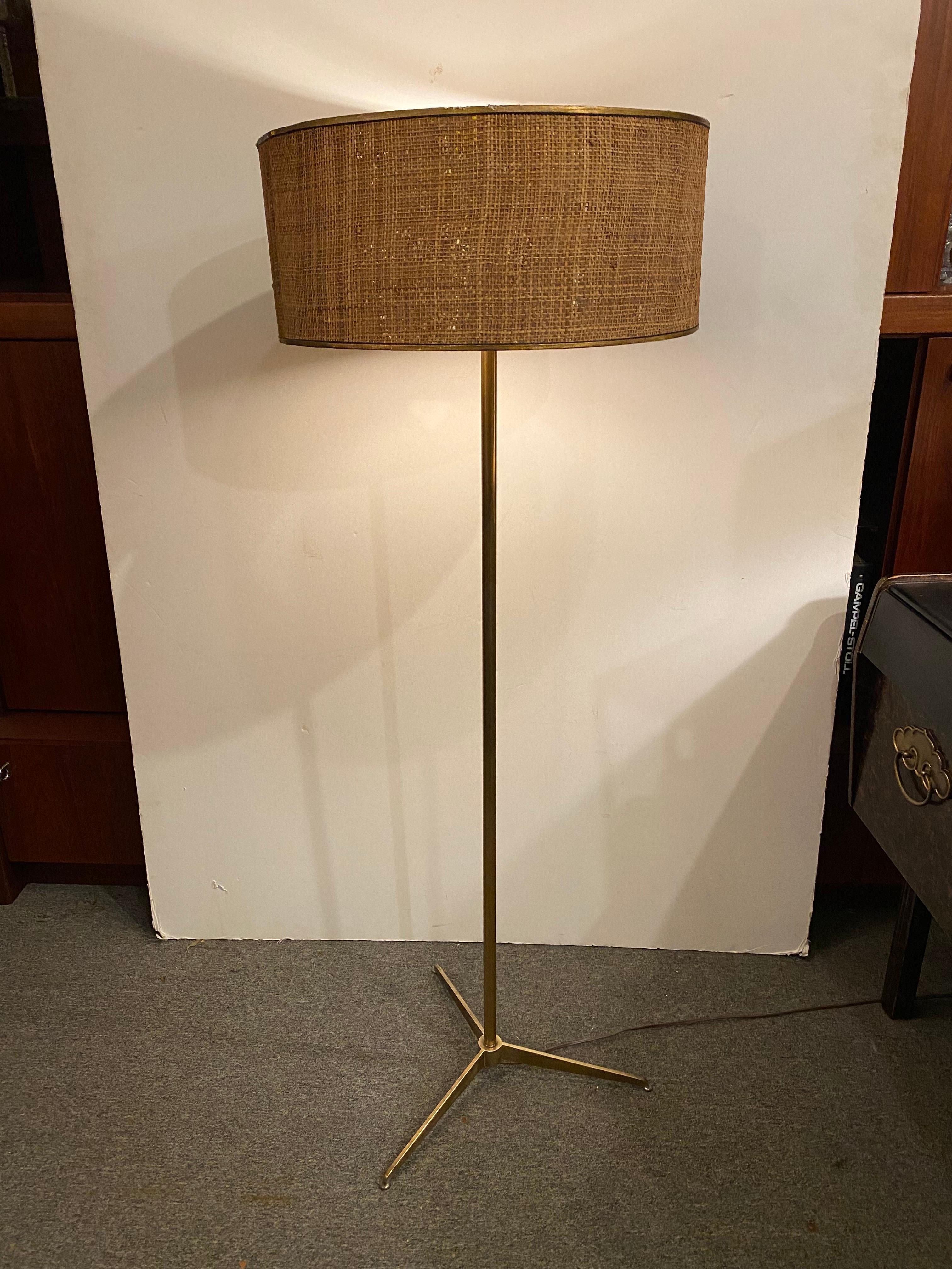 Lightolier Brass Tripod Floor Lamp.  3 way switch turns 1, 2, or all 3 bulbs on.  Still retains its plastic diffusor.  Looks very much like some of the McCobb designs that were produced in the 1950's, but this has the typical lightolier switch and