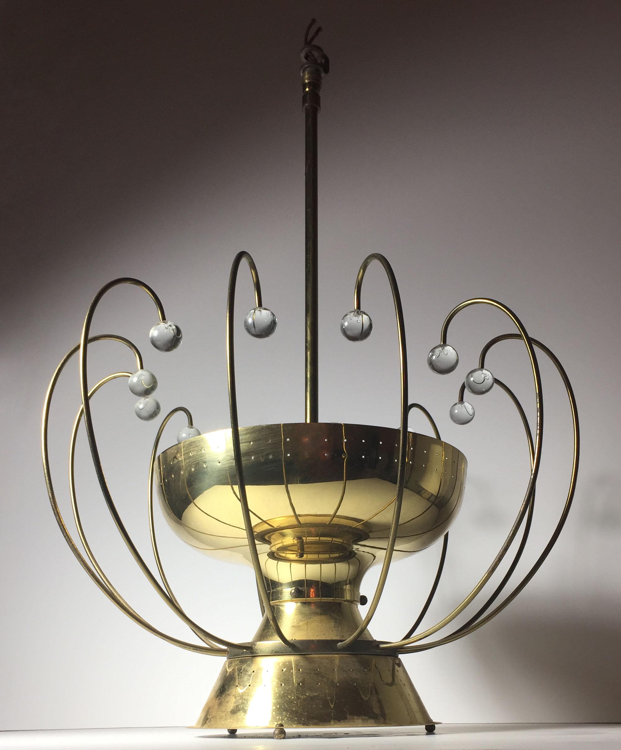 Vintage Lightolier fixture with large crystal beads attributed to Gerald Thurston. A quality vintage fixture. Reminiscent of Italian fixtures by Arredoluce by Gino Sarfatti and Paavo Tynell

I believe this probably originally had a glass diffuser at