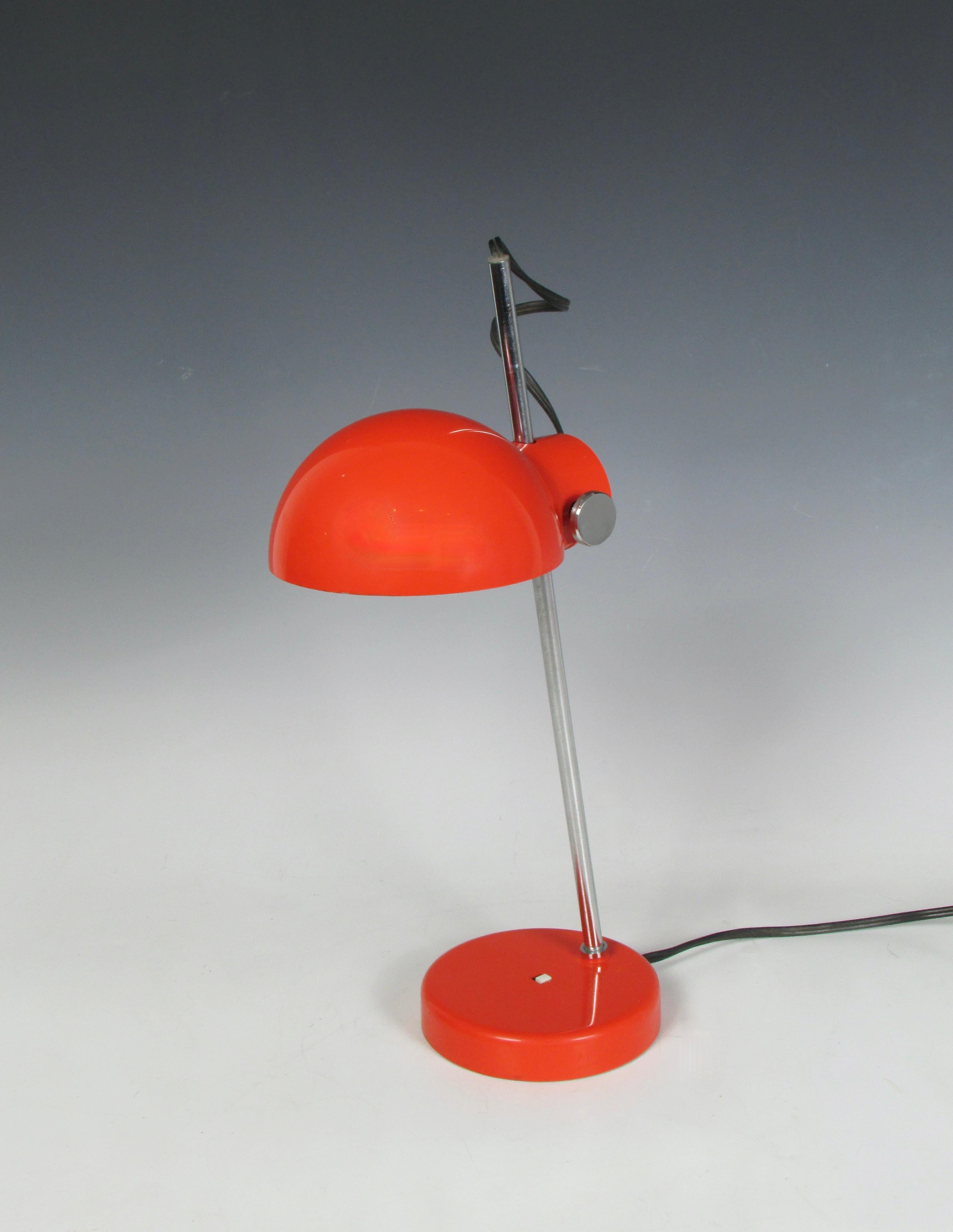 Space age lamp made in Japan for Lightolier. Weighted steel base supports chrome shaft holding adjustable plastic shade.