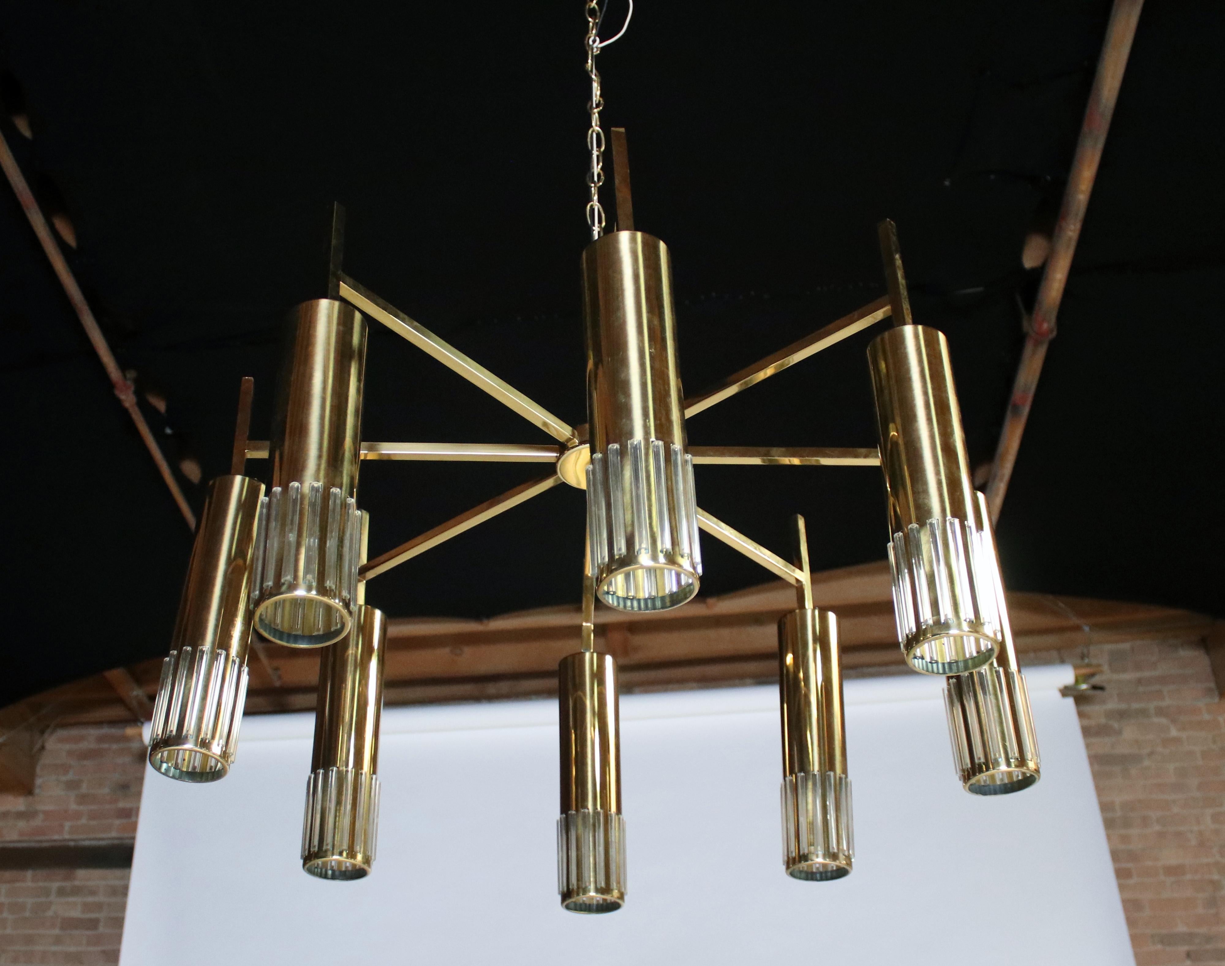 Midcentury brass chandelier or semi flush mount fixture by Lightolier. Features 8 arms and removable hanging brass and Lucite pendants. Cord is 22