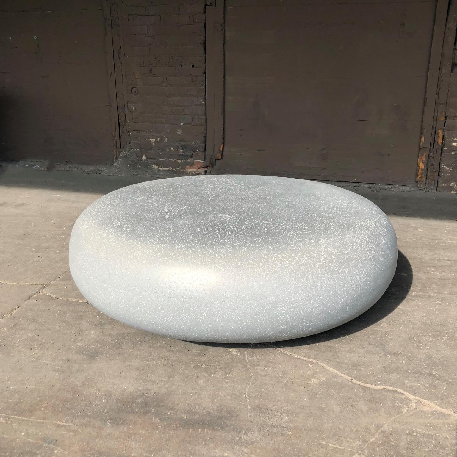Like a stone from a stream, smoothed for millennia by the passing currents. The fluid potential of natural power emanates from its presence.

Dimensions: Diameter 48 in. (122 cm). Height 15 in. (38 cm). Weight 70 lbs. (32 kg).

Finish color