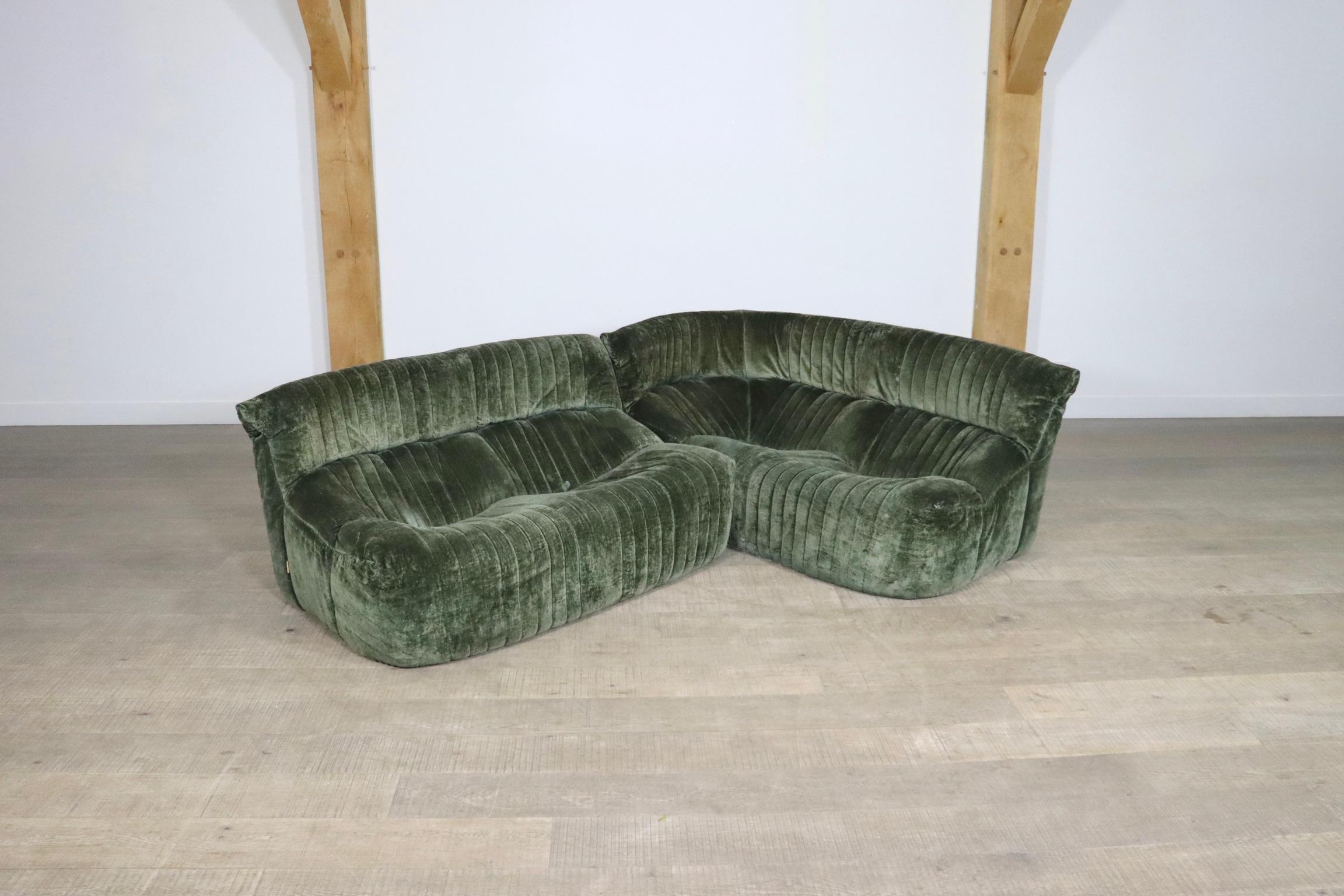 Rare vintage Aralia two seater sofa, and two seater corner sofa in original green velvet by Michel Ducaroy for Ligne Roset in the 1970s. The stunning original green velvet upholstery combines perfectly with the unique design. Comfortable and