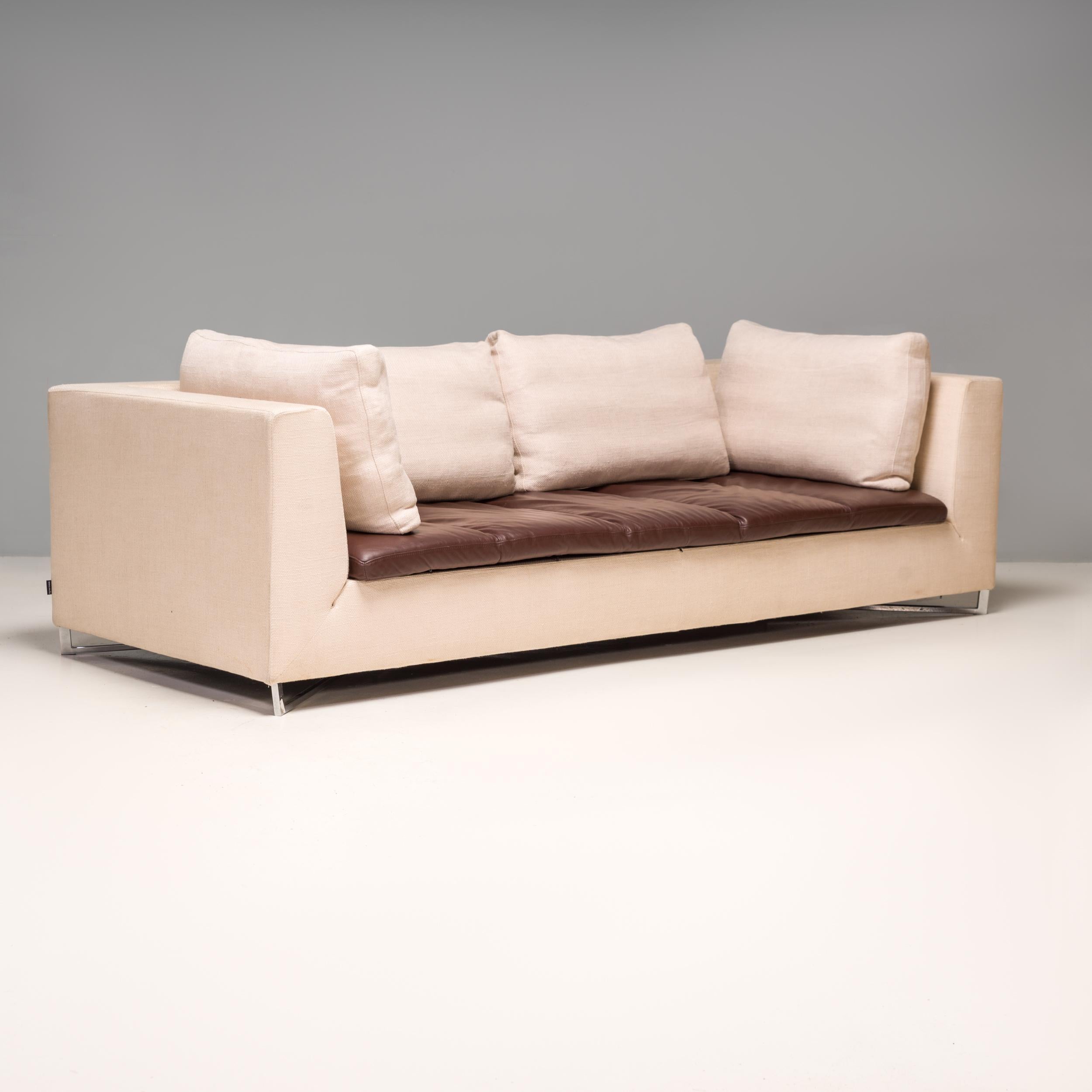 Designed by Didier Gomez for Ligne Roset, this Feng three-seat sofa combines modern elegance with ultimate comfort.

The sturdy frame is upholstered in ivory woven fabric and sits on an angular chrome base. 

The fabric is contrasted by the quilted