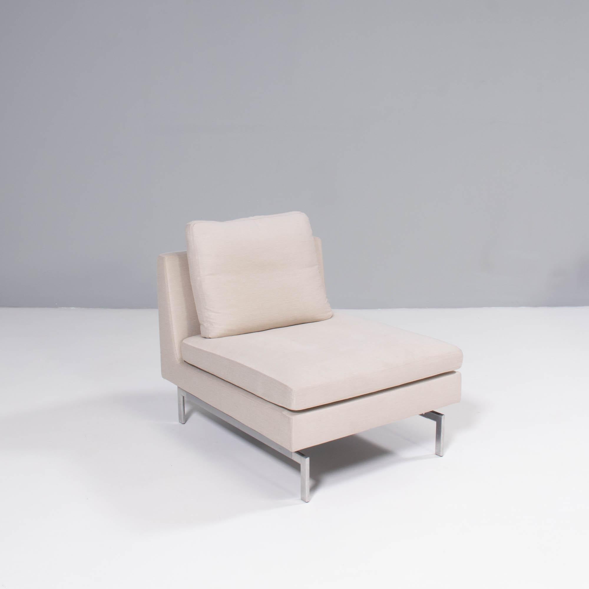 Originally designed by Didier Gomez for Ligne Roset in 2014, the Stricto Sensu fireside chair offers the maximum comfort within a streamline design.

The fireside chairs, fully upholstered in cream fabric, feature a separate seat and back cushions