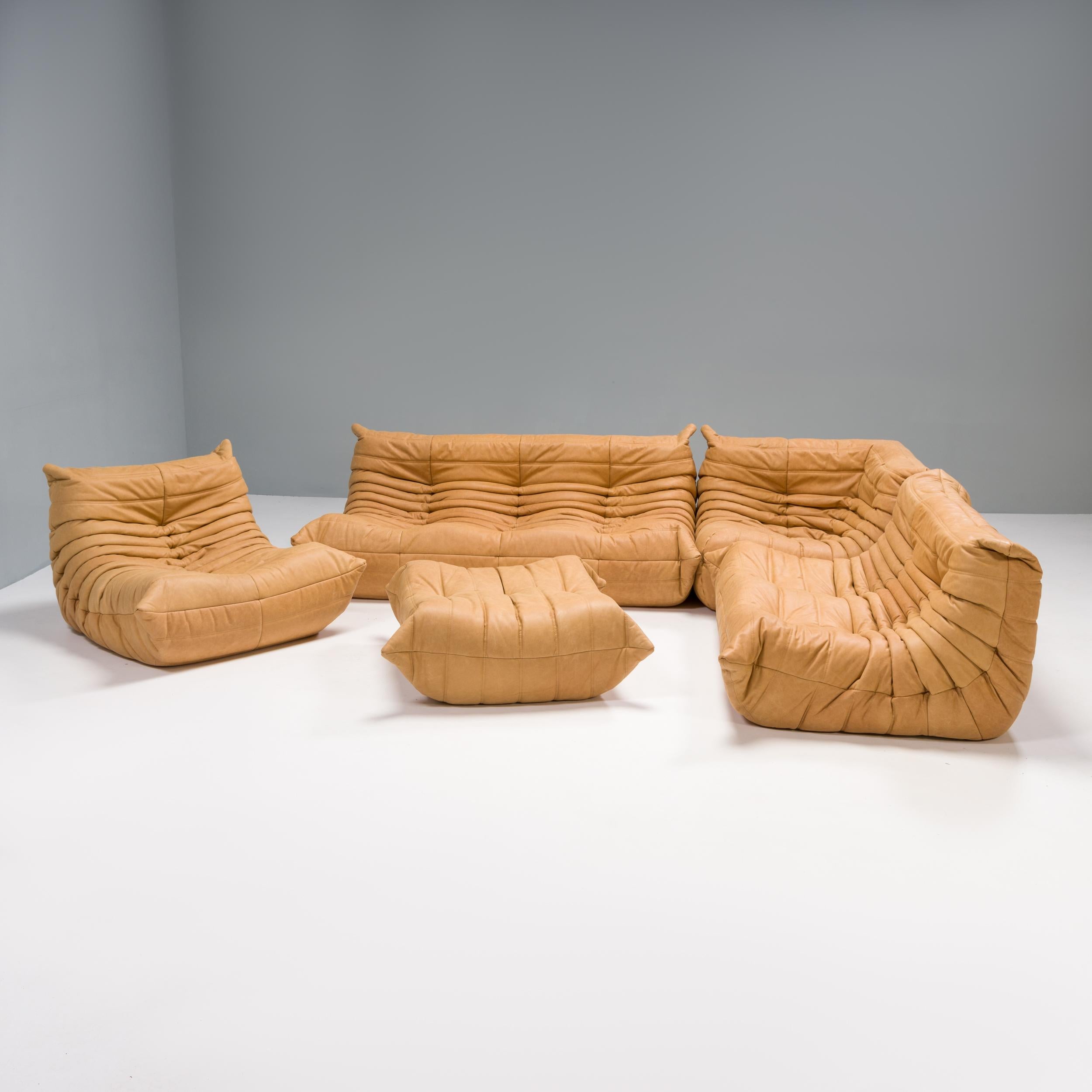 The iconic Togo orange sofa set, originally designed by Michel Ducaroy for Ligne Roset in 1973, has become a design mid century classic.

The sofas have been newly reupholstered in a soft supple camel leather fabric. Made completely from foam, with