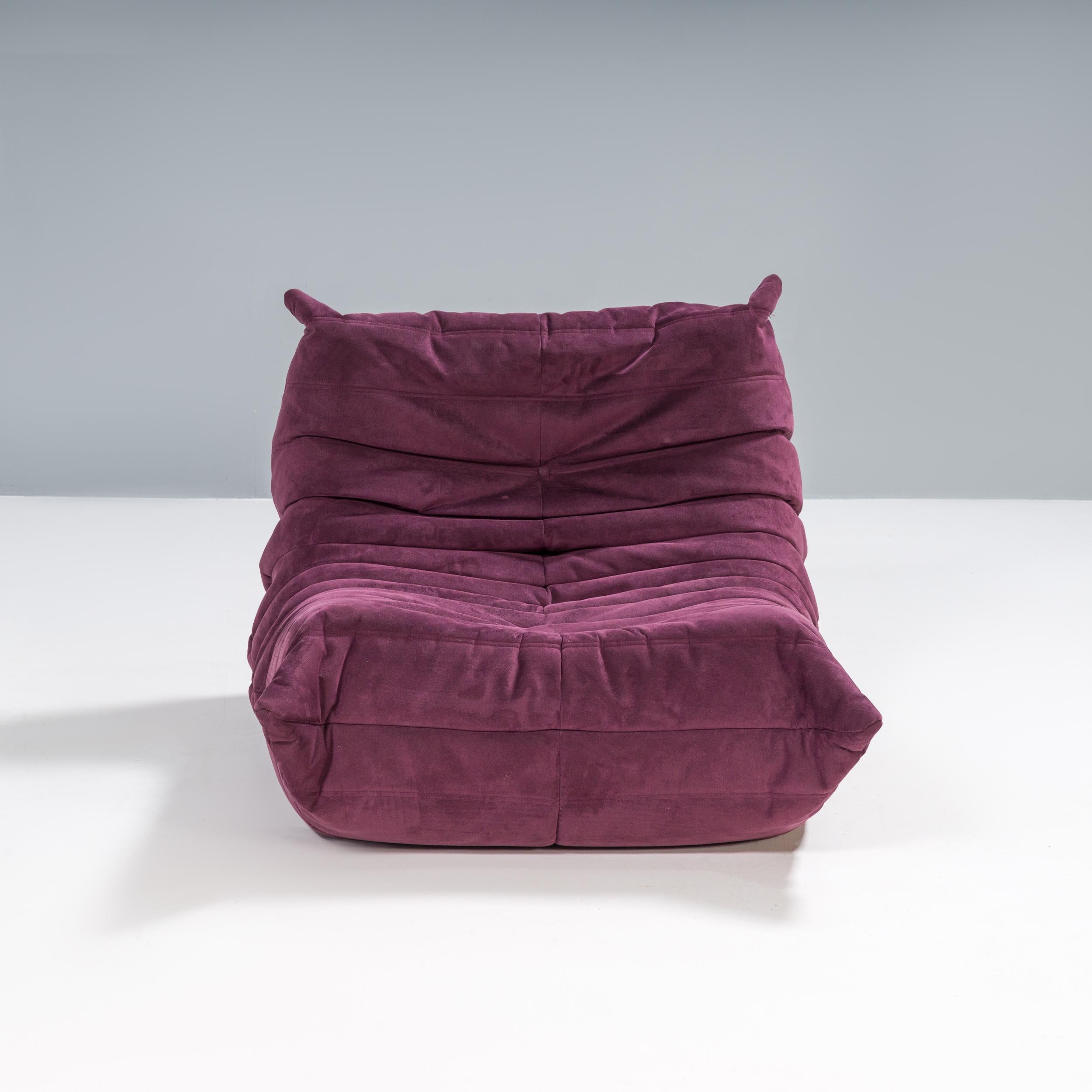 The iconic Togo sofa, originally designed by Michel Ducaroy for Ligne Roset in 1973, has become a design classic. 

This armchair is covered in aubergine fabric and features the instantly recognisable pleated fabric design, which gives it its