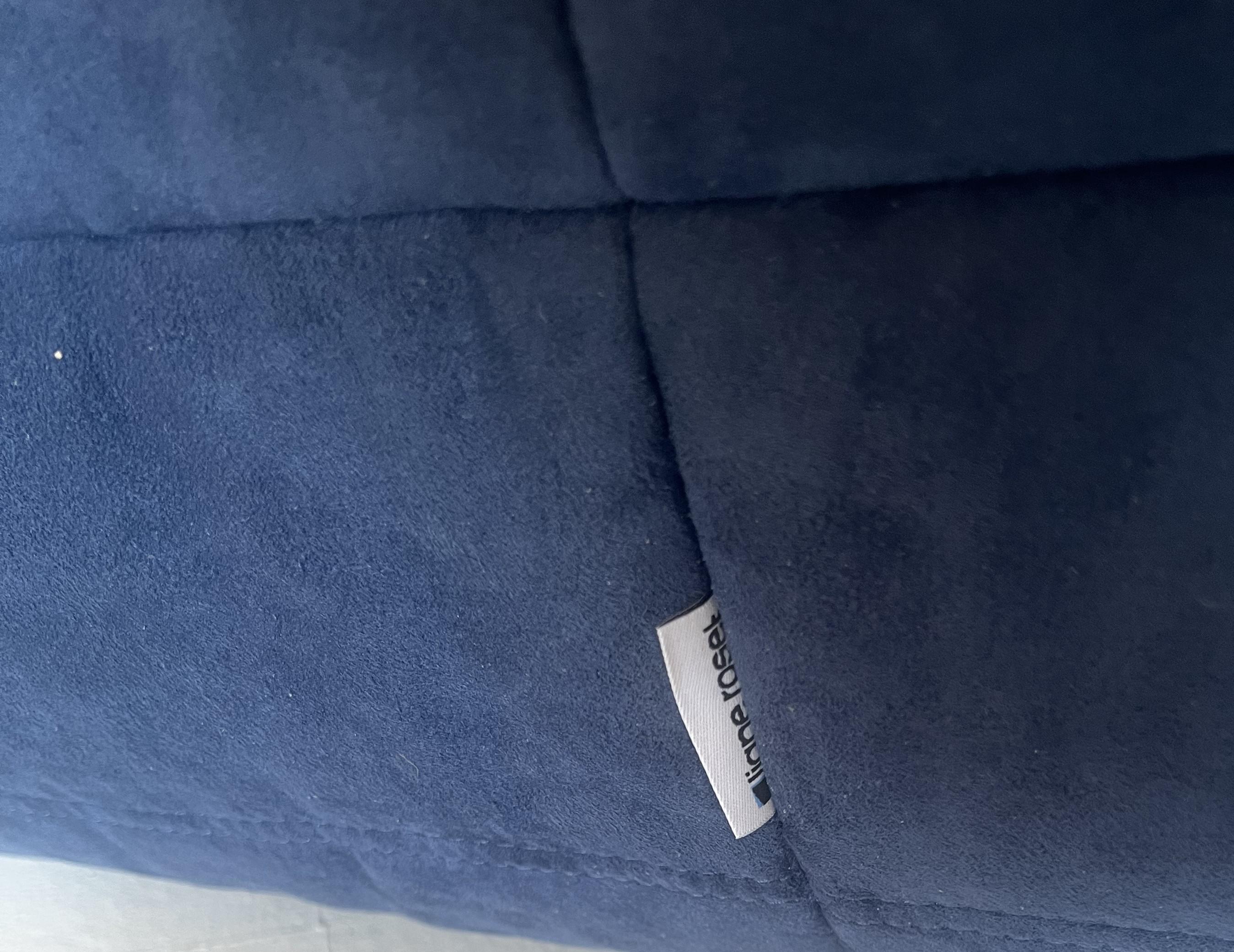 The iconic Togo sofa, originally designed by Michel Ducaroy for Ligne Roset in 1973, has become a design Classic.

This footstool is has been newly reupholstered in a soft, bright blue fabric.

The pieces feature the instantly recognizable