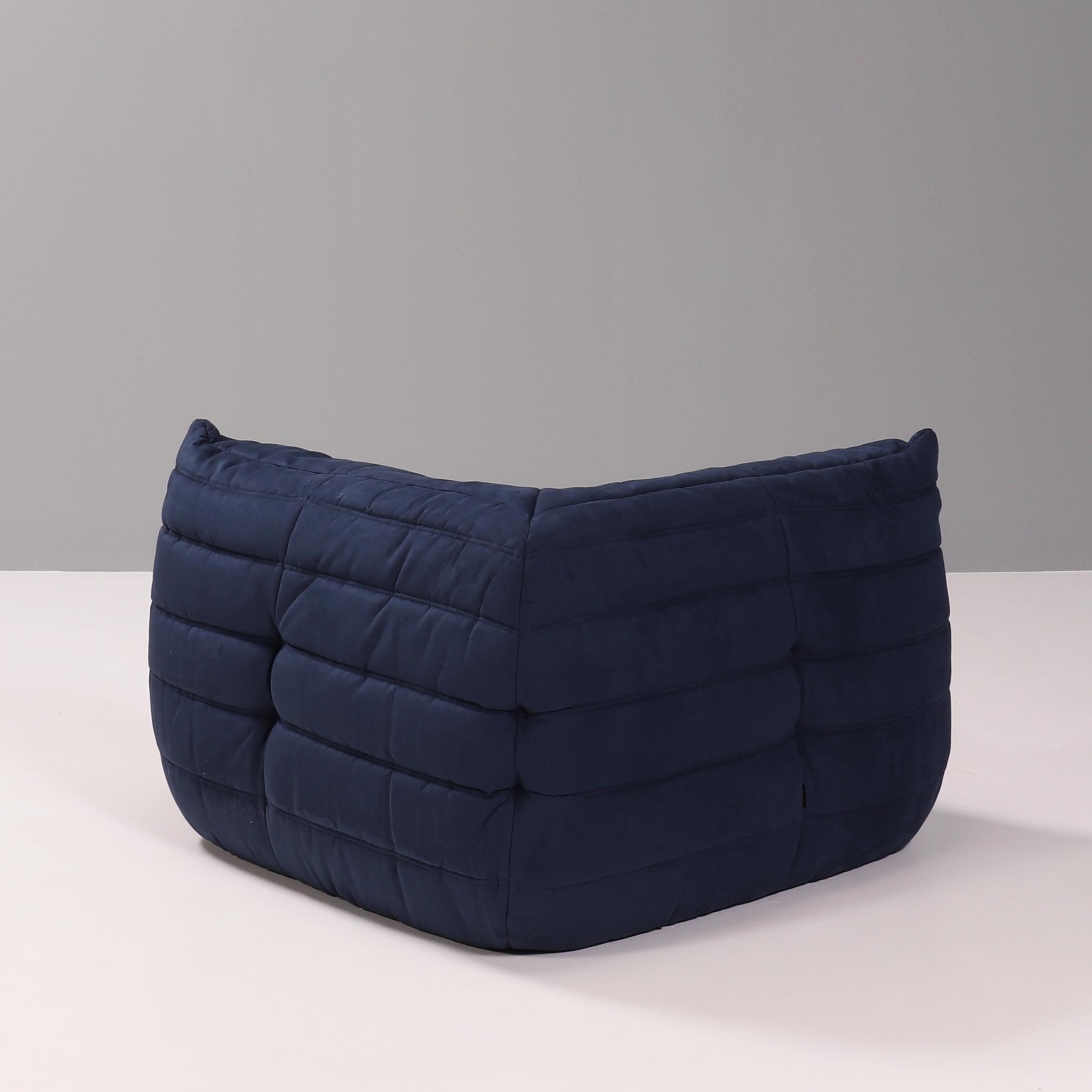 The iconic Togo sofa, originally designed by Michel Ducaroy for Ligne Roset in 1973 has become a design Classic.

The corner seat features new dark blue upholstery and the instantly recognizable pleated fabric design, which gives the sofa its