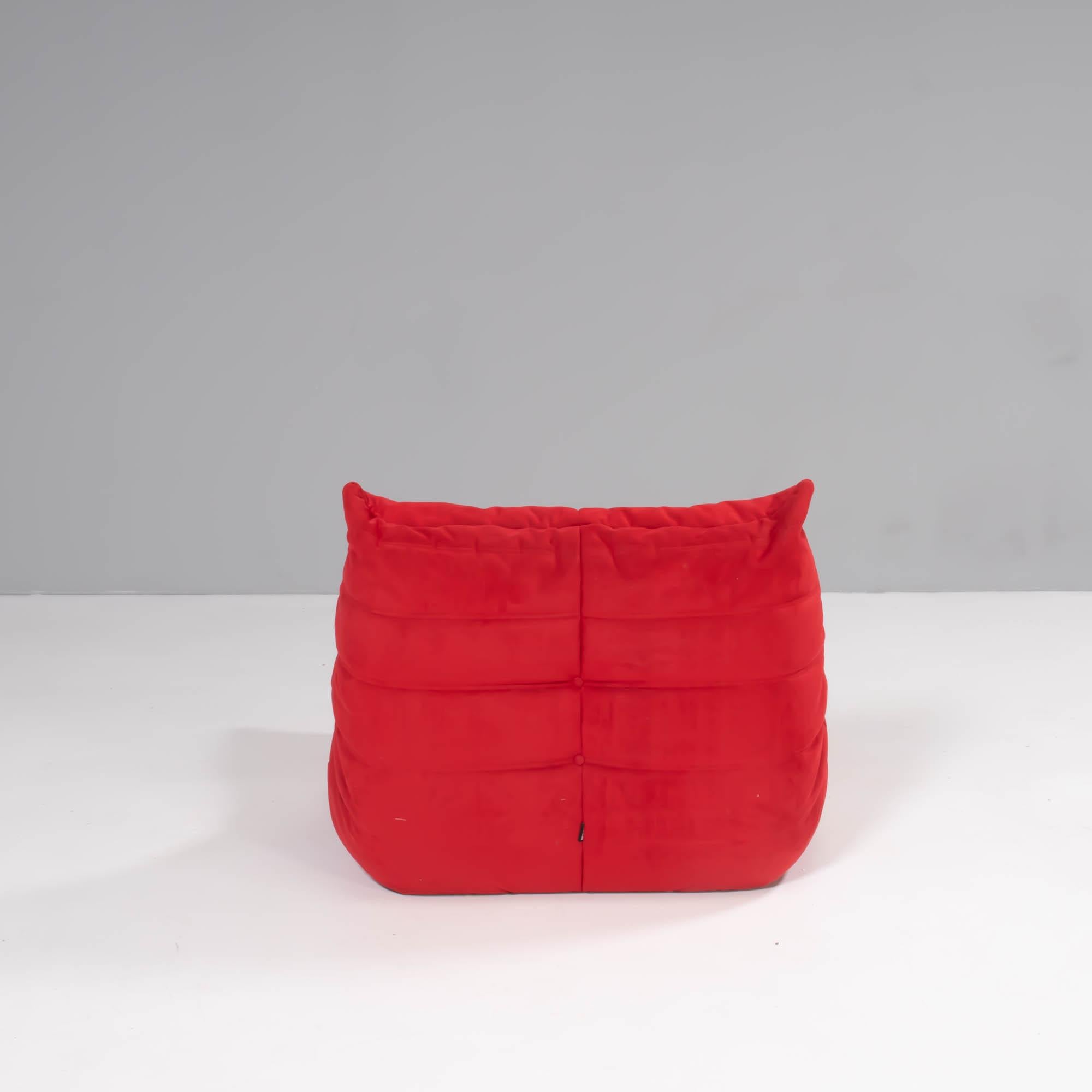 The iconic Togo sofa, originally designed by Michel Ducaroy for Ligne Roset in 1973 has become a design Classic.

The footstool features the original red Alcantara upholstery and the instantly recognizable pleated fabric design, which gives the