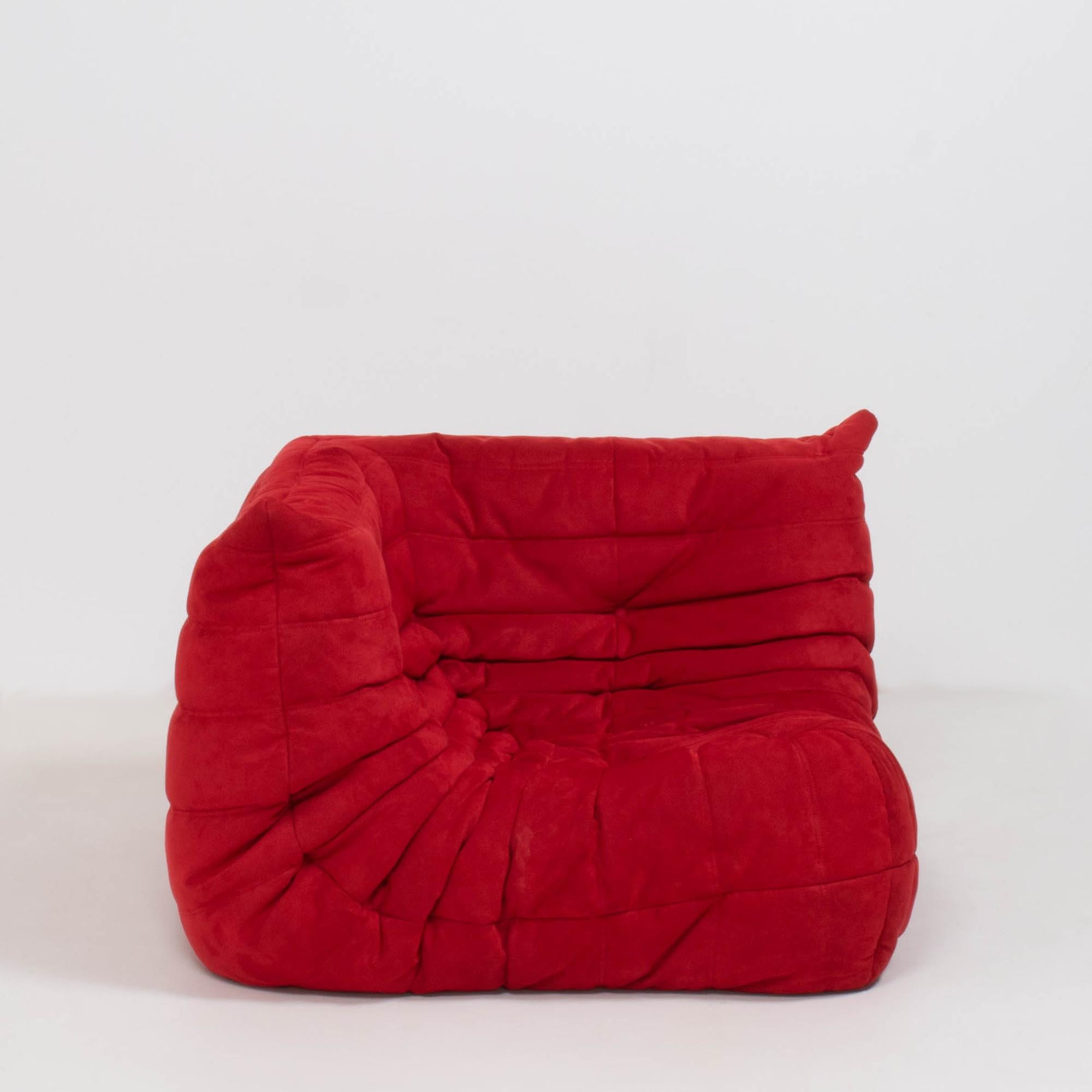 The iconic Togo sofa, originally designed by Michel Ducaroy for Ligne Roset in 1973 has become a design Classic.

The corner seat features the original red suede upholstery and the instantly recognizable pleated fabric design, which gives the sofa