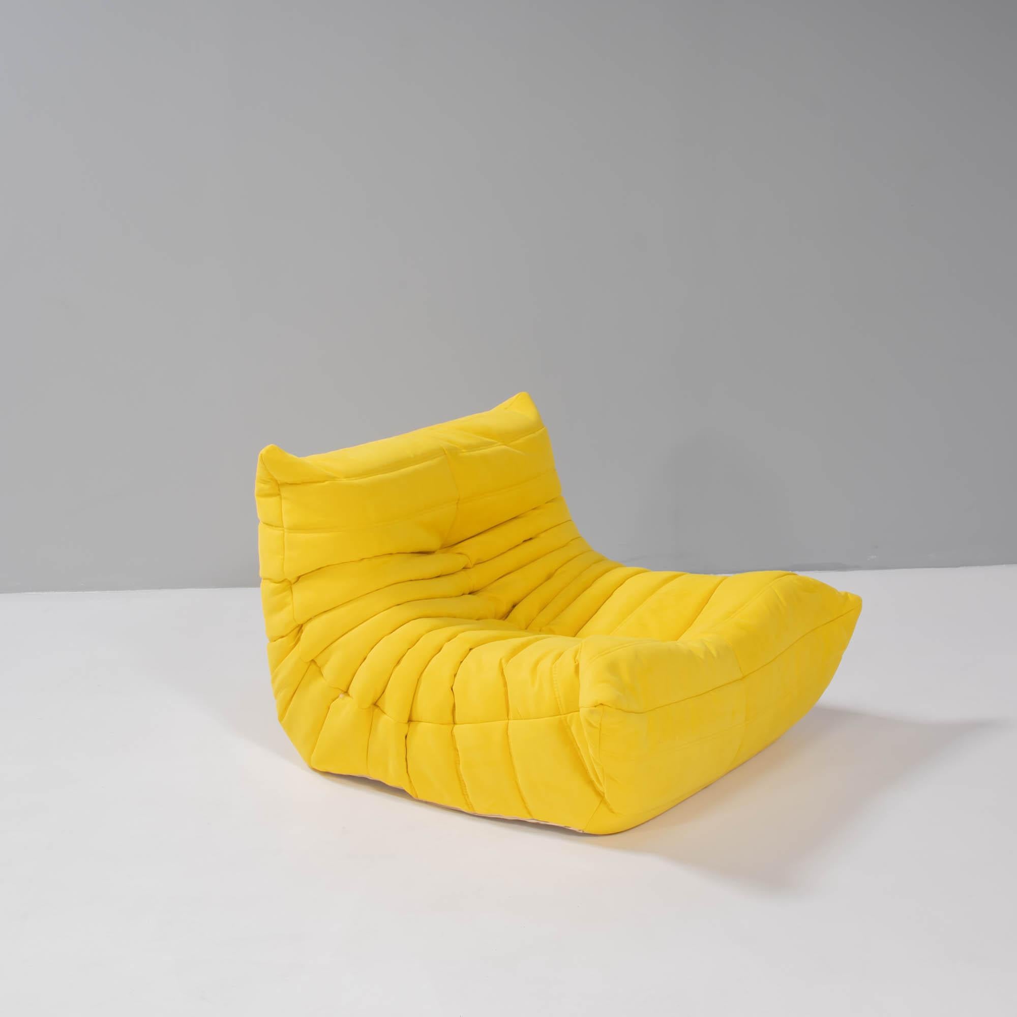The iconic Togo yellow sofa, originally designed by Michel Ducaroy for Ligne Roset in 1973, has become a design mid century classic.

This fireside armchair and footstool is incredibly versatile and can be used alone or paired with other pieces