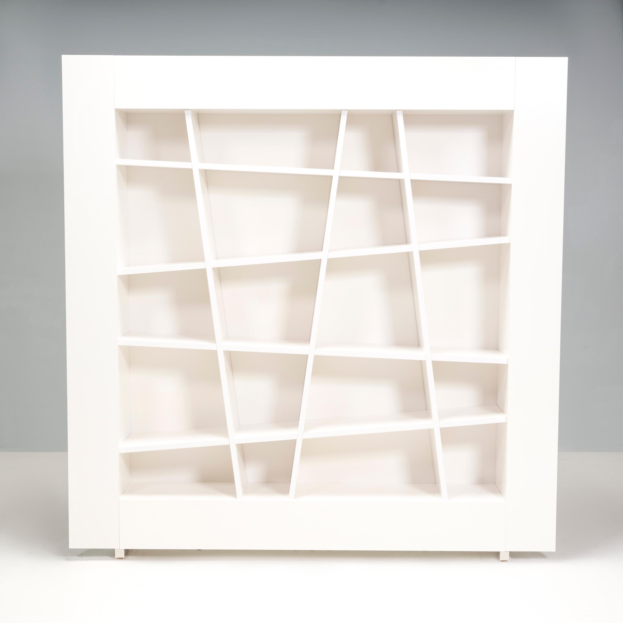 The Lines bookcase designed by Peter Maly for Ligne Roset is composed by sloping shelves and interior panels which are characterized by numerous lines that intersect themselves.

The shelves sit on brilliant chrome steel feet and the wood frame and