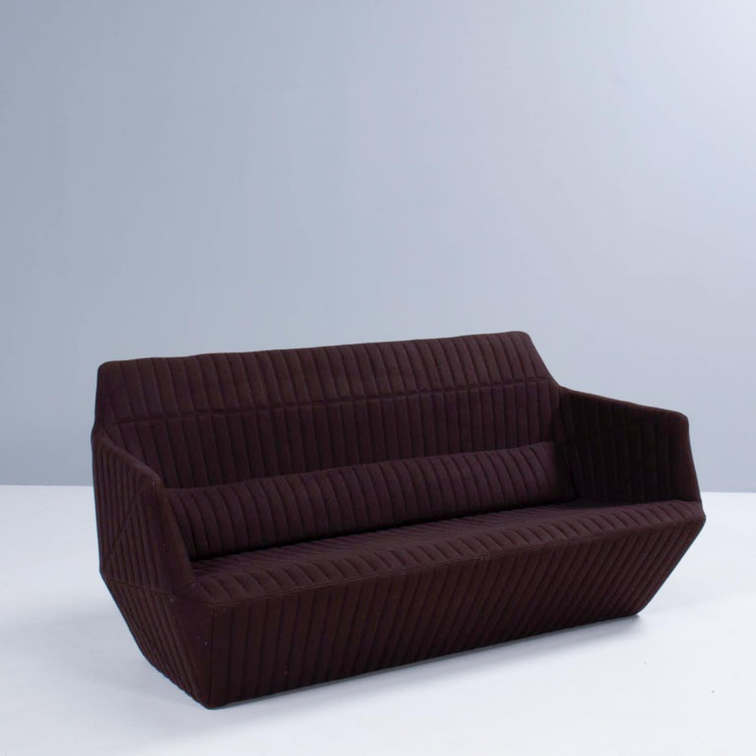 Designed by Ronan and Erwan Bouroullec in 2005, the Facett sofa balances minimalism and complexity to create a sophisticated modern design.

The sofa is a large, single structure with integral back and seat cushions with an additional lumbar