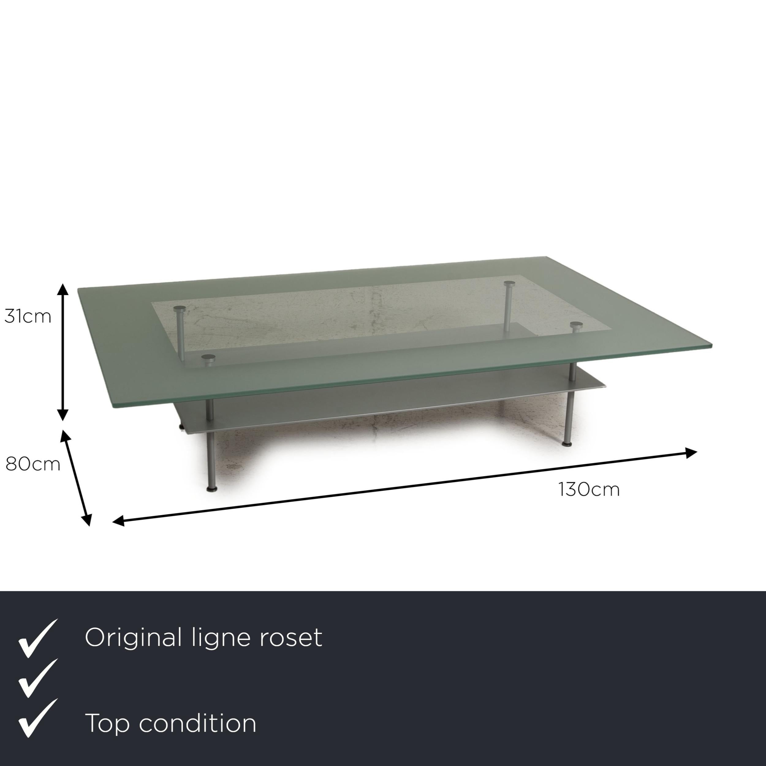 We present to you a Ligne Roset Cailleres glass table gray coffee table.


 Product measurements in centimeters:
 

 Depth: 80
 Width: 130
 Height: 31.





  