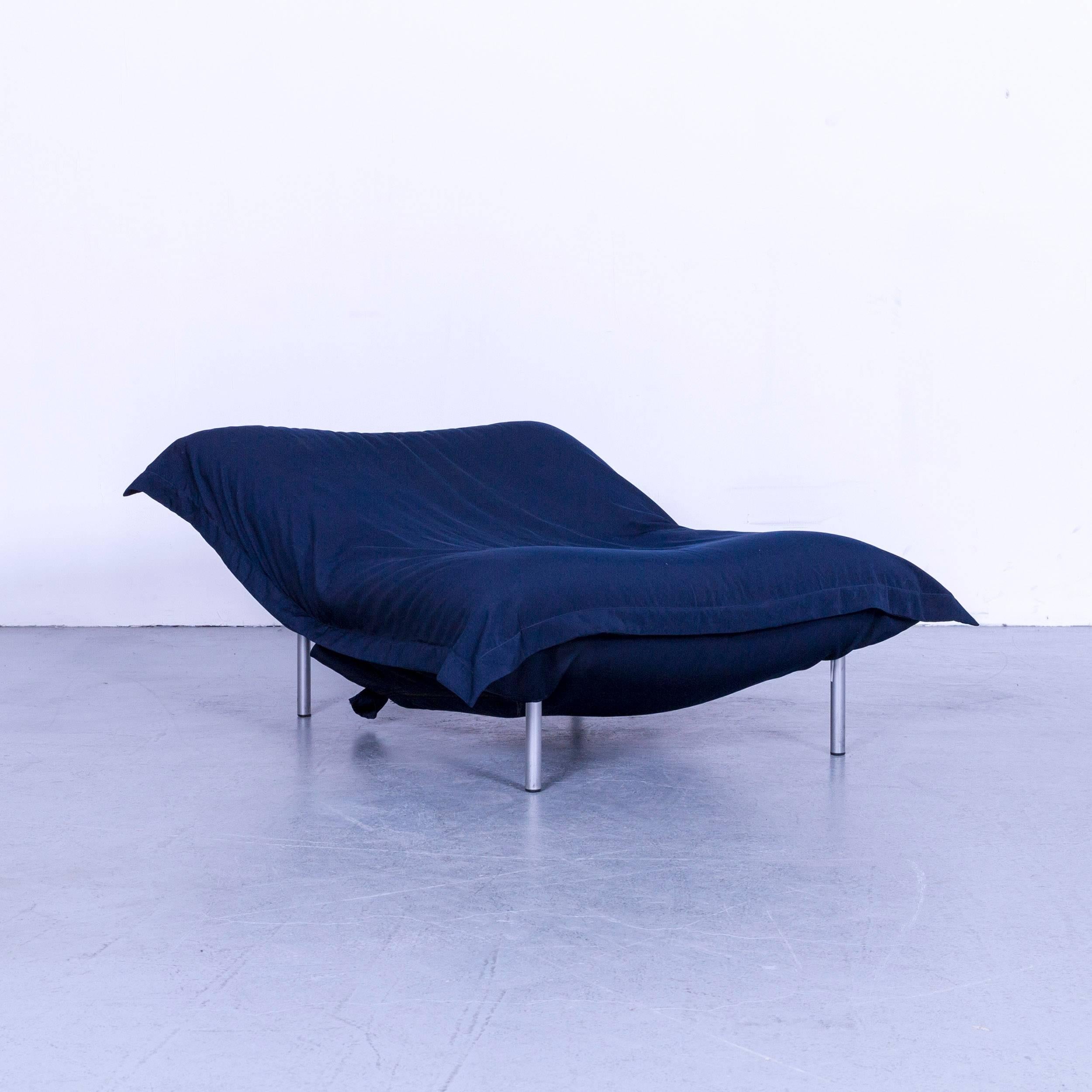 We bring to you an Ligne Roset Calin fabric chair blue one-seat couch.














 