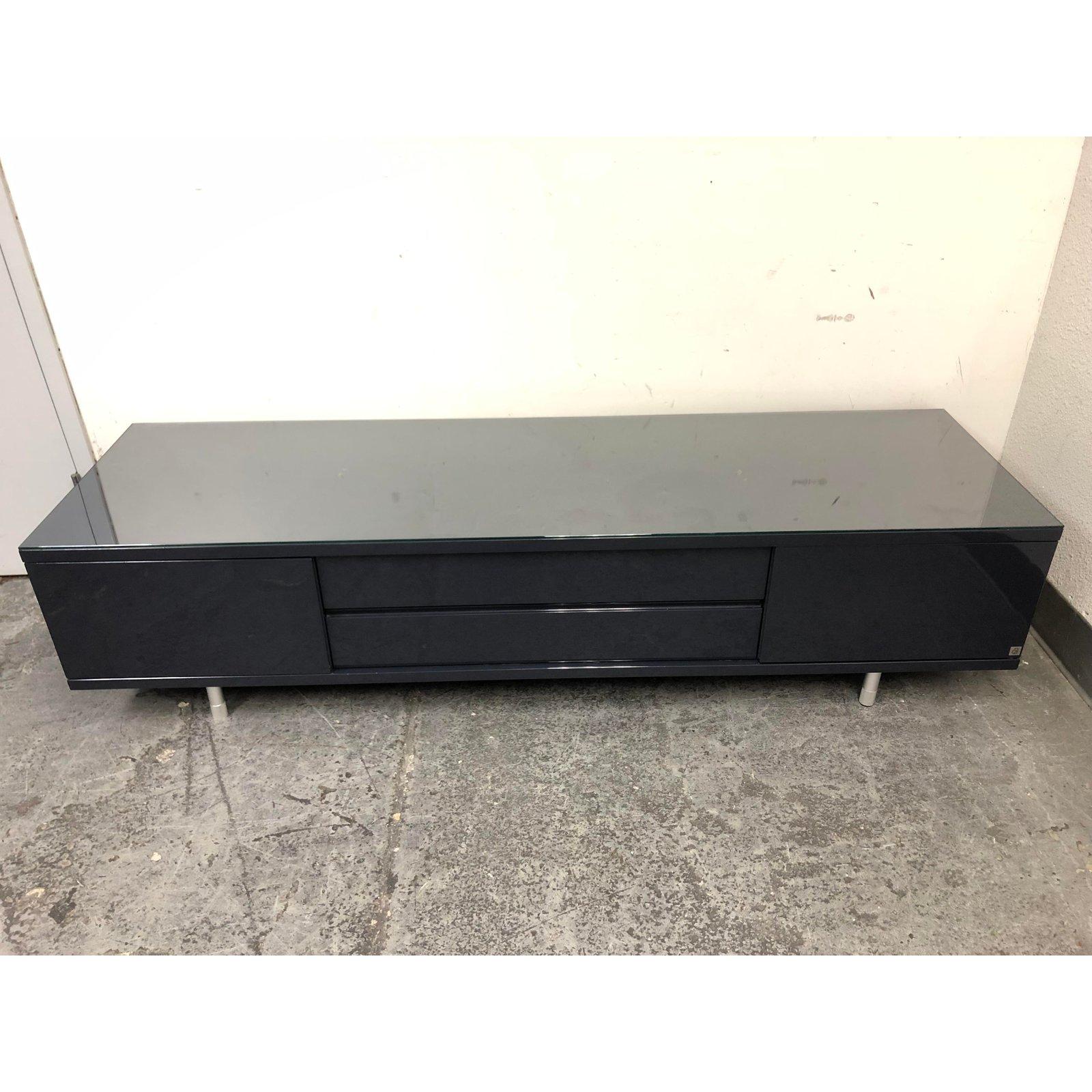 An everywhere Media Entertainment Podium unit by Designer Christian Werner. Perfect podium for sound bar/television and plenty of storage. Two swing open doors with two middle pullout drawers. Shiny dark blue lacquer finish adds a sleek modern decor