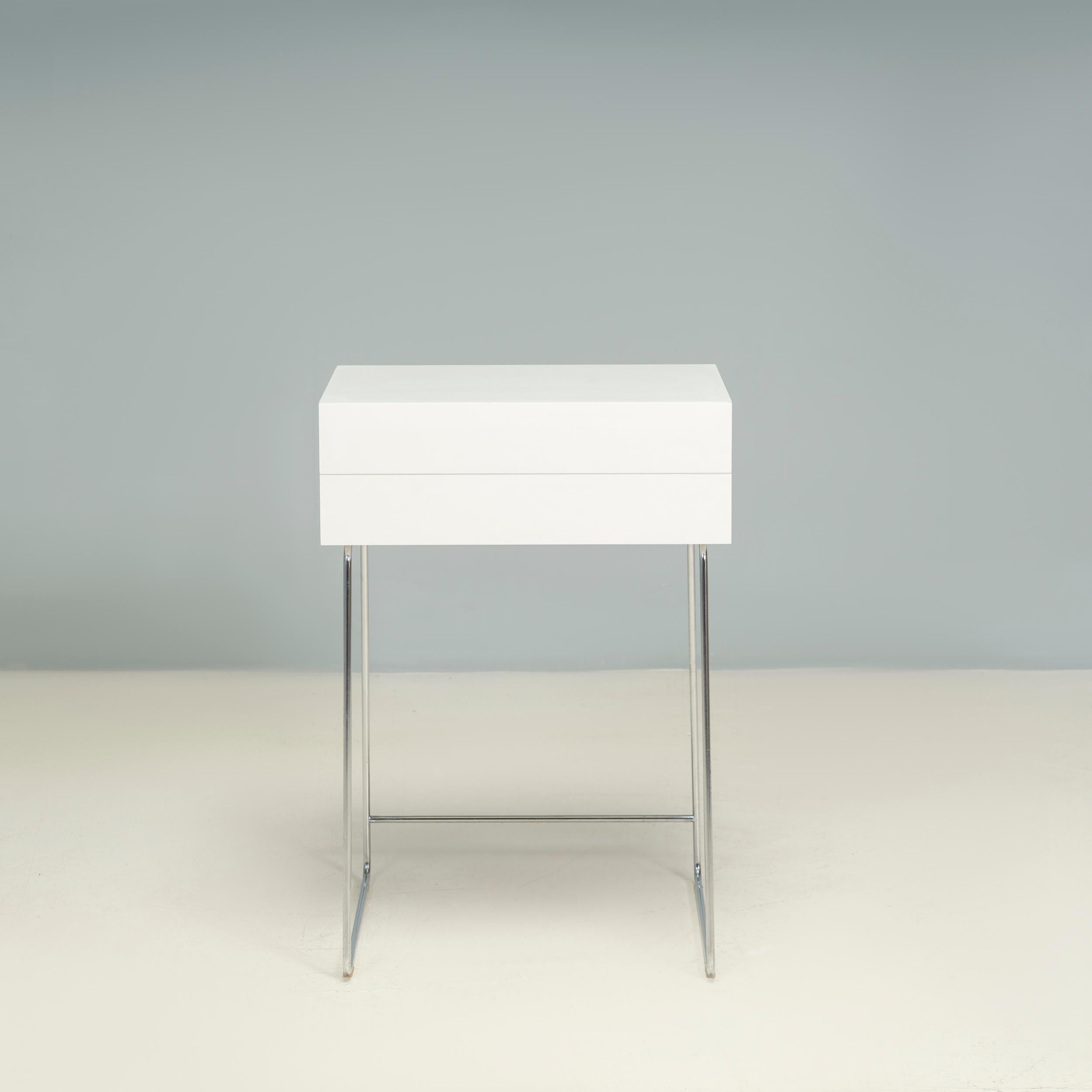 Originally designed by Julie Pfligersdorffer for Ligne Roset in 2008, the Poms desk gives the classic secretaires a contemporary twist.

Constructed from two layers of white laminate, the desk sits on angled chrome sled legs.

The top of the desk