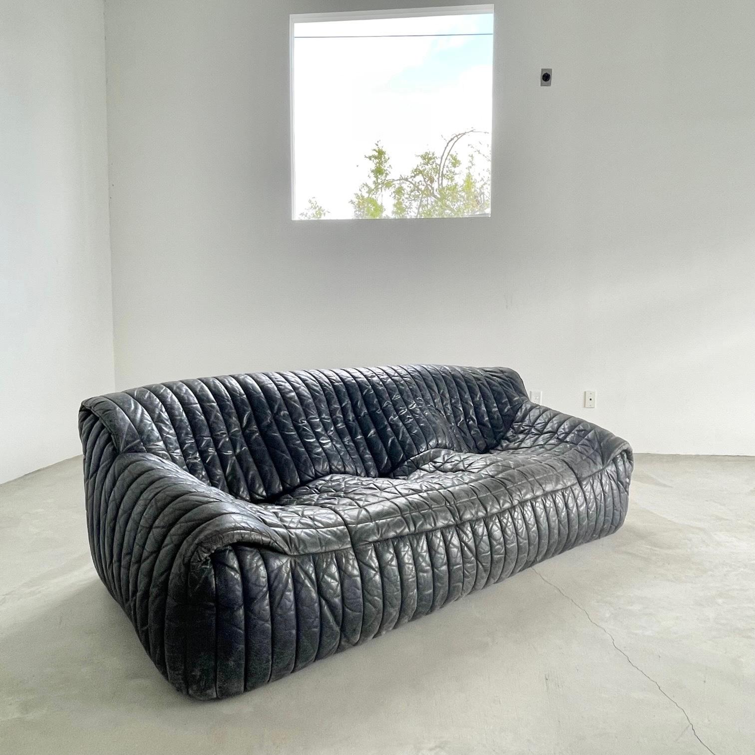 Leather sofa designed by Annie Hieronimus for Ligne Roset. 1980s. Cinna Sandra model. 3 seater. Original deep navy leather. Good condition with some wear as shown. Extremely stylish and comfortable sofa. 

 