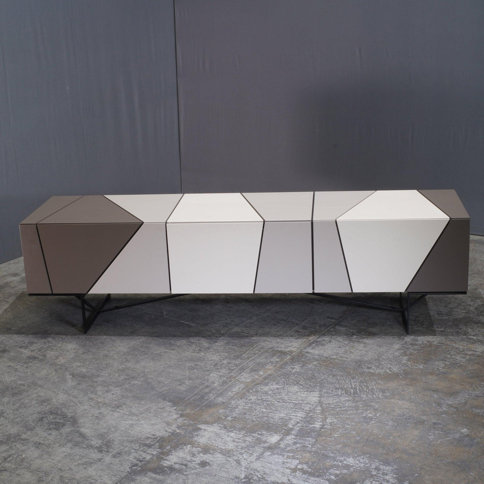 The Ligne Roset Limited Edition Lines Sideboard by Peter Maly is a striking piece that exemplifies modern minimalism with a touch of artistic flair. Crafted in a sleek, linear design, the sideboard features clean lines and a refined silhouette,