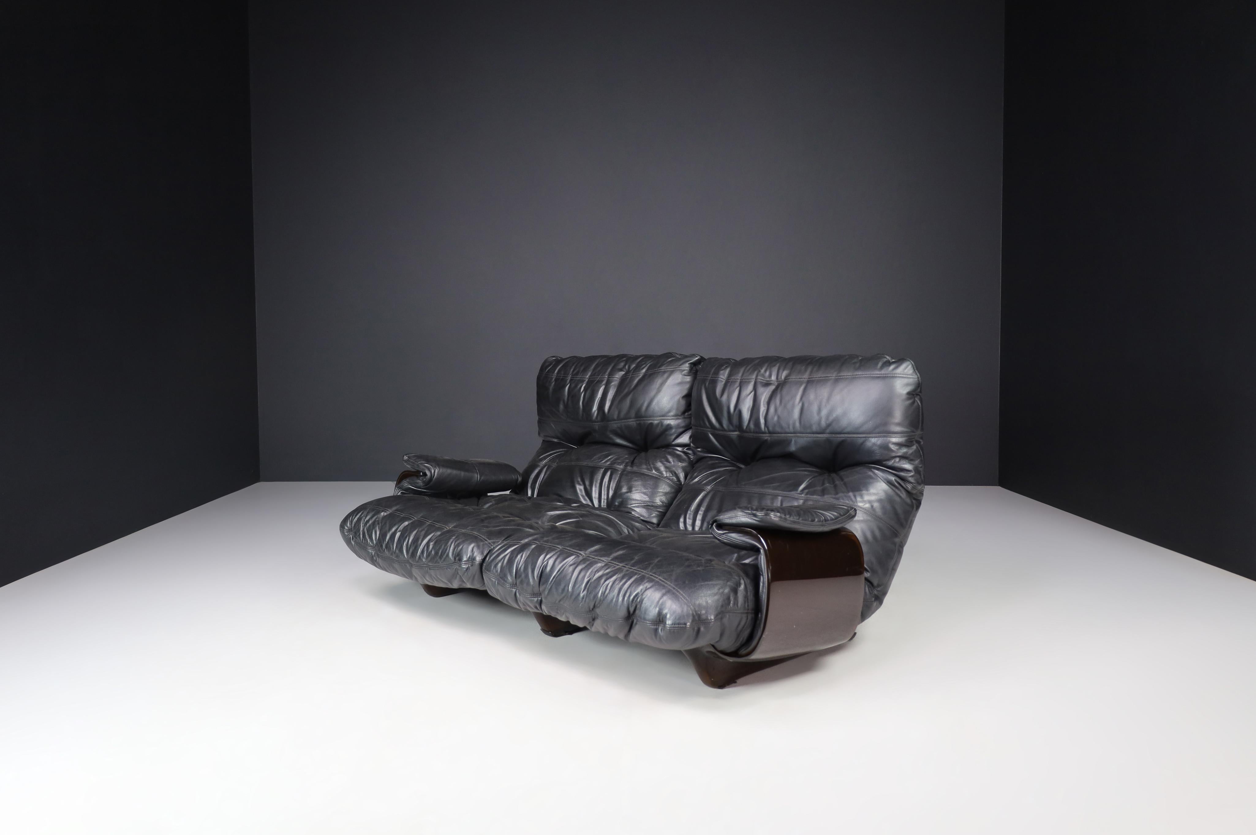 Ligne Roset Marsala sofa in black leather by Michel Ducaroy, the 1970s.

Good-looking black leather Marsala two-seater sofa by Michel Ducaroy for Ligne Roset 1970s. The large leather cushions in a smoke-colored plexiglass shell give a clean but