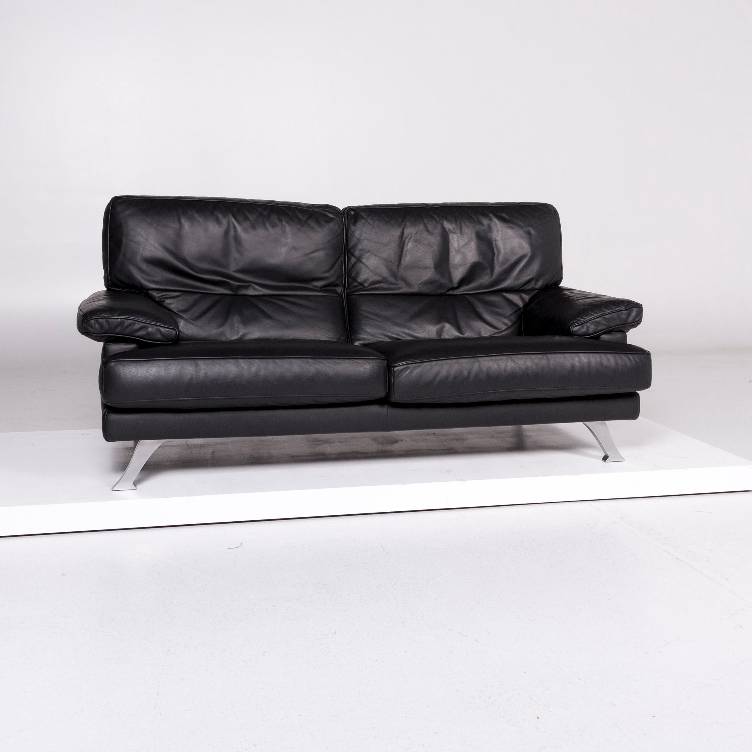 We bring to you a Ligne Roset melody leather sofa black two-seat couch.

 Product measurements in centimeters:
 
Depth 93
Width 185
Height 86
Seat-height 42
Rest-height 53
Seat-depth 56
Seat-width 127
Back-height 46.
 