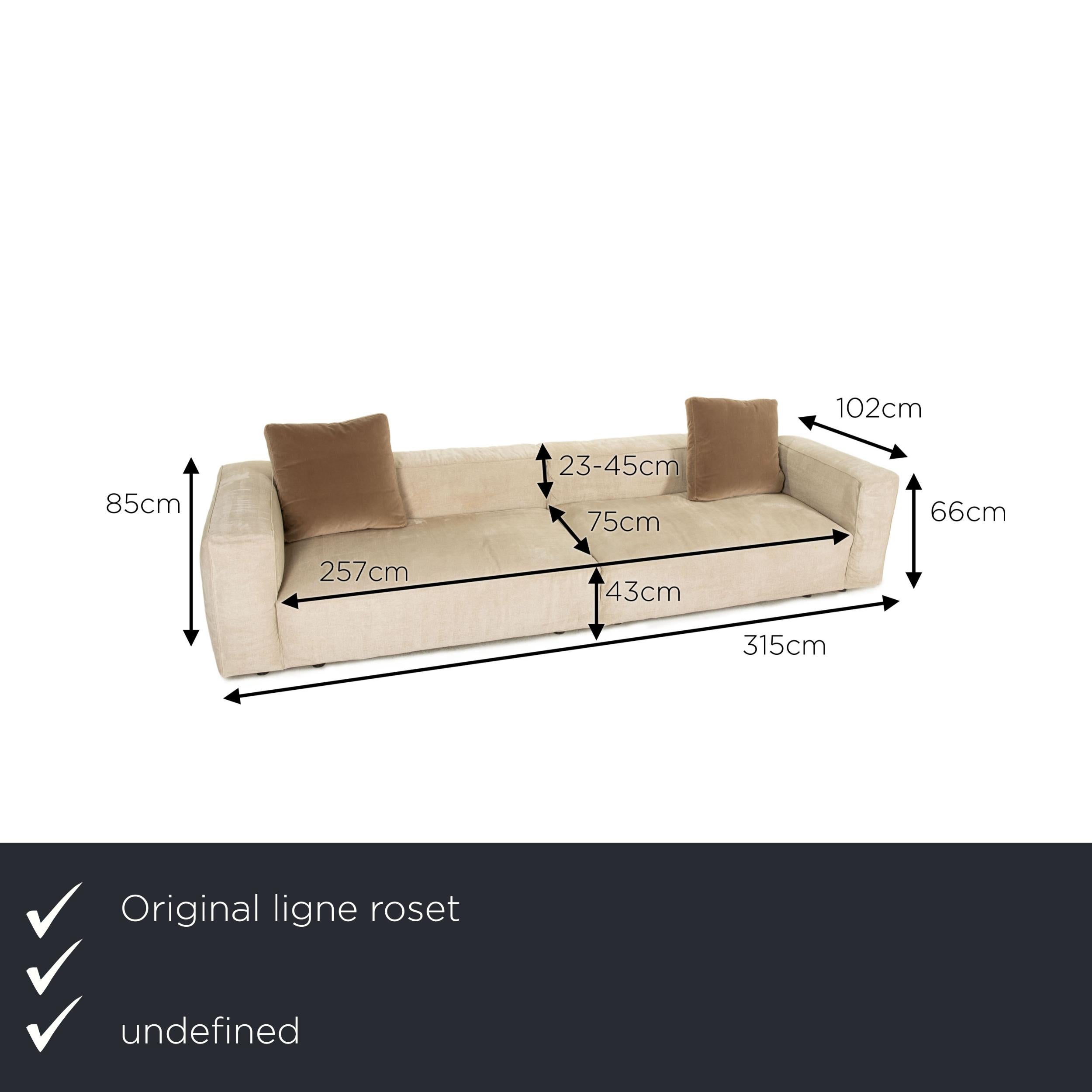 We present to you a Ligne Roset Nils fabric sofa set cream 1x four-seat 1x stool.
 SKU: #17110
 

 Product measurements in centimeters:
 

 depth: 102
 width: 315
 height: 85
 seat height: 43
 rest height: 66
 seat depth: 75
 seat