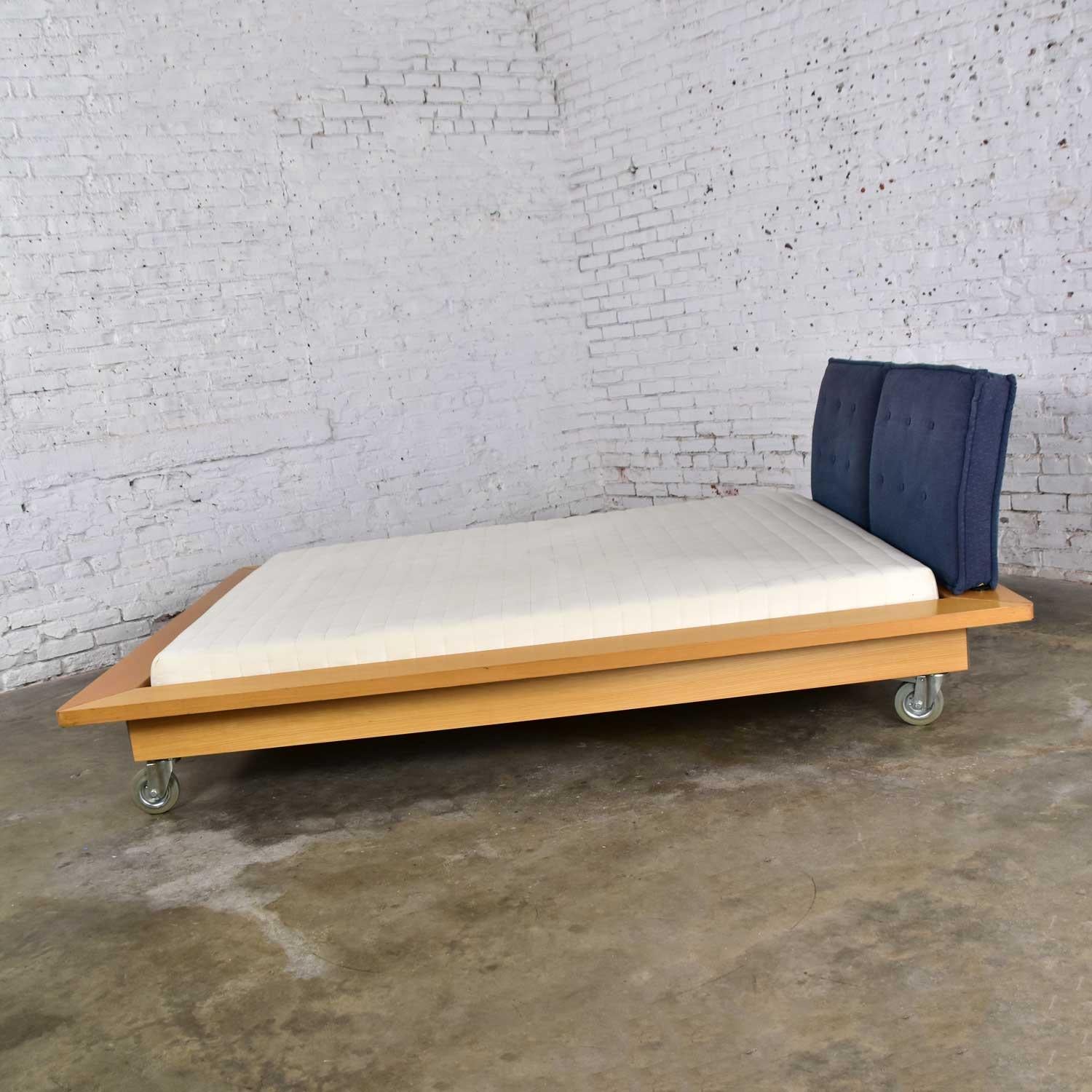 Wonderful Ligne Roset Parallele Postmodern European King size (77 x 63 x 6) platform bed attributed to Peter Maly. Comprised of ashwood veneer frame and gray anodized plate aluminum spacers; webbed platform slats; 5-inch rubber casters; and a