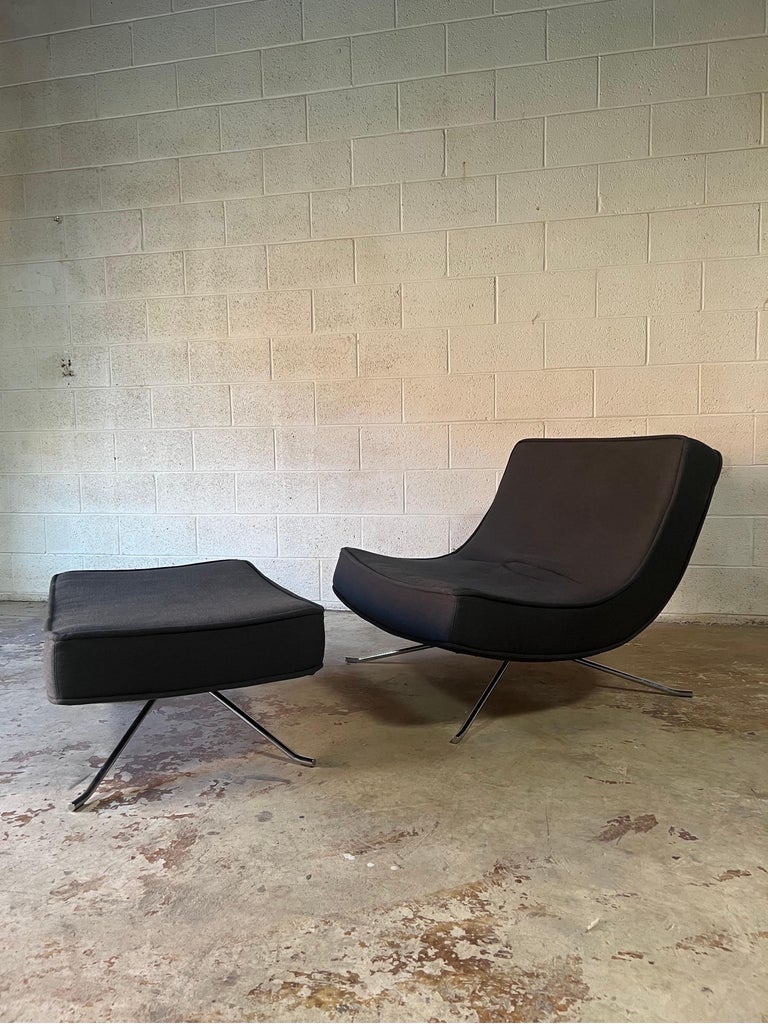 Lounge and ottoman made by French company Ligne Roset and designed by Christian Werner circa 1990’s. The ‘Pop’ chair allows for extremely comfortable seating position. The profile of the chair has soft curves and a scoop look. Accompanied with sleek