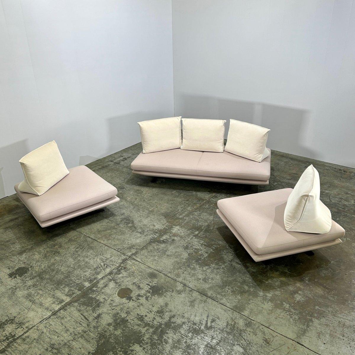 Introducing the Ligne Roset Prado Sofa and Ottomans, designed by Christian Werner. This stunning set is the epitome of luxury and sophistication, with its sleek lines and contemporary design. Crafted with the highest quality materials, the Prado