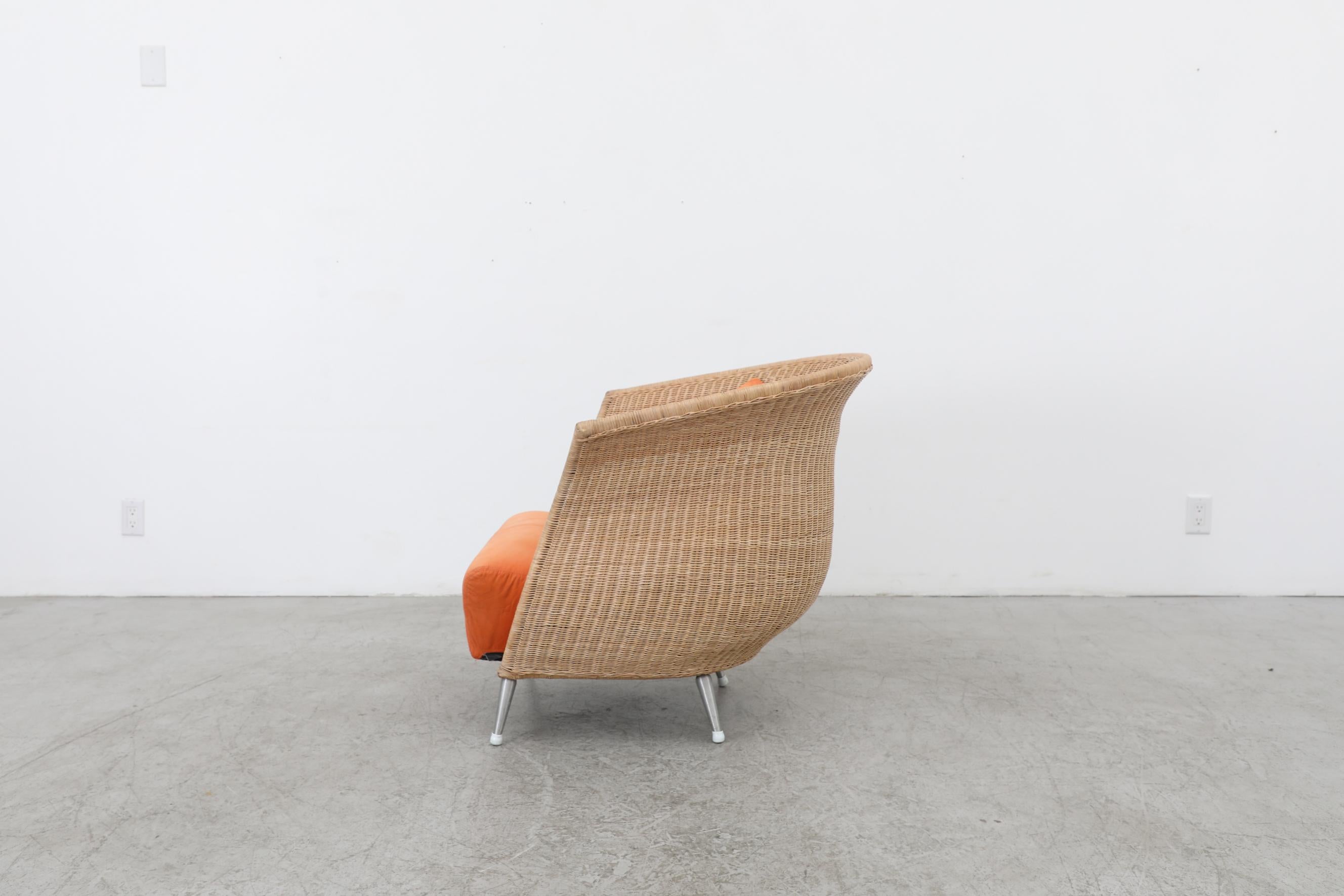 French Ligne Roset Organic Shaped Rattan Lounge Chair w/ Orange Cushions & Metal Feet For Sale