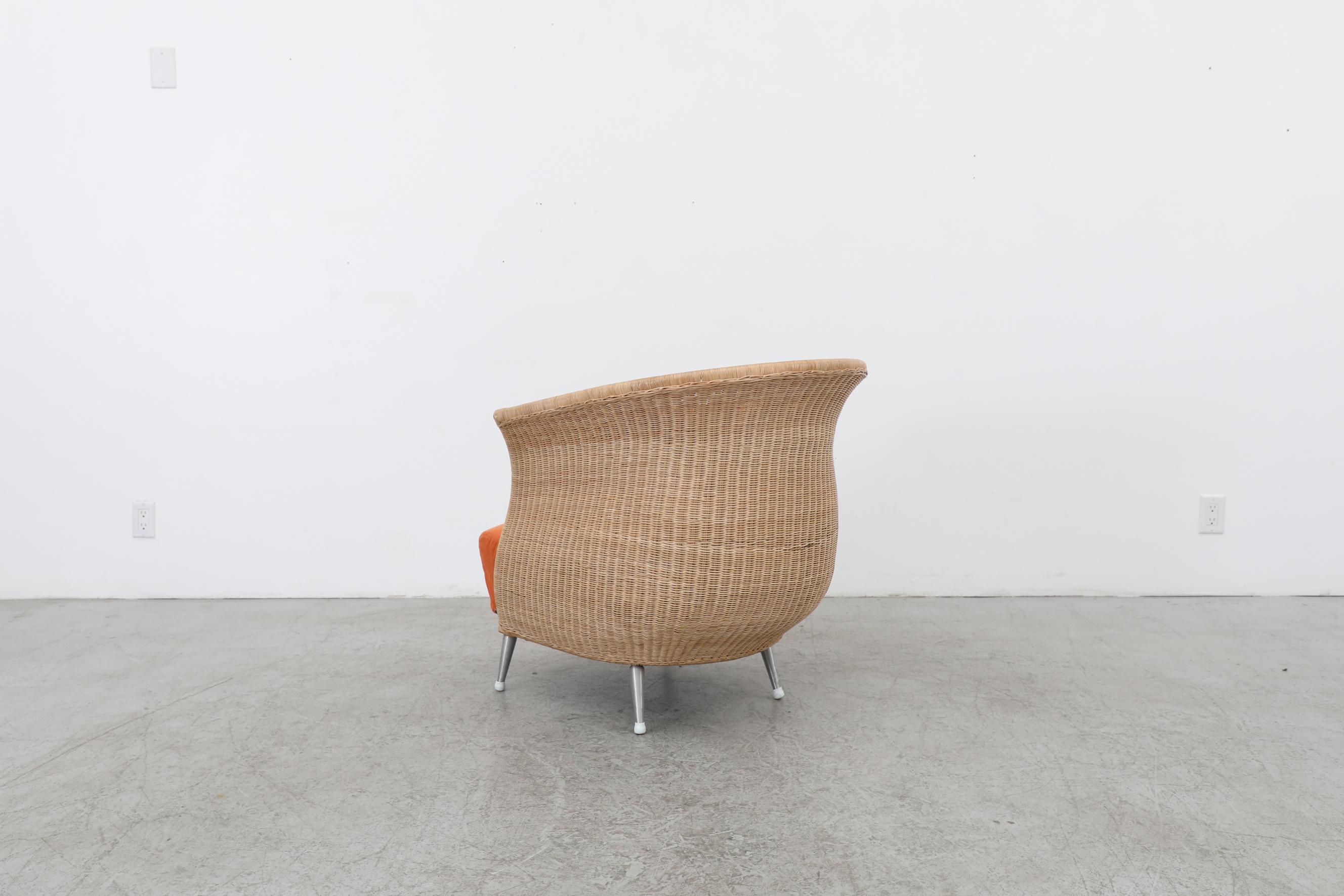 Ligne Roset Organic Shaped Rattan Lounge Chair w/ Orange Cushions & Metal Feet In Good Condition For Sale In Los Angeles, CA