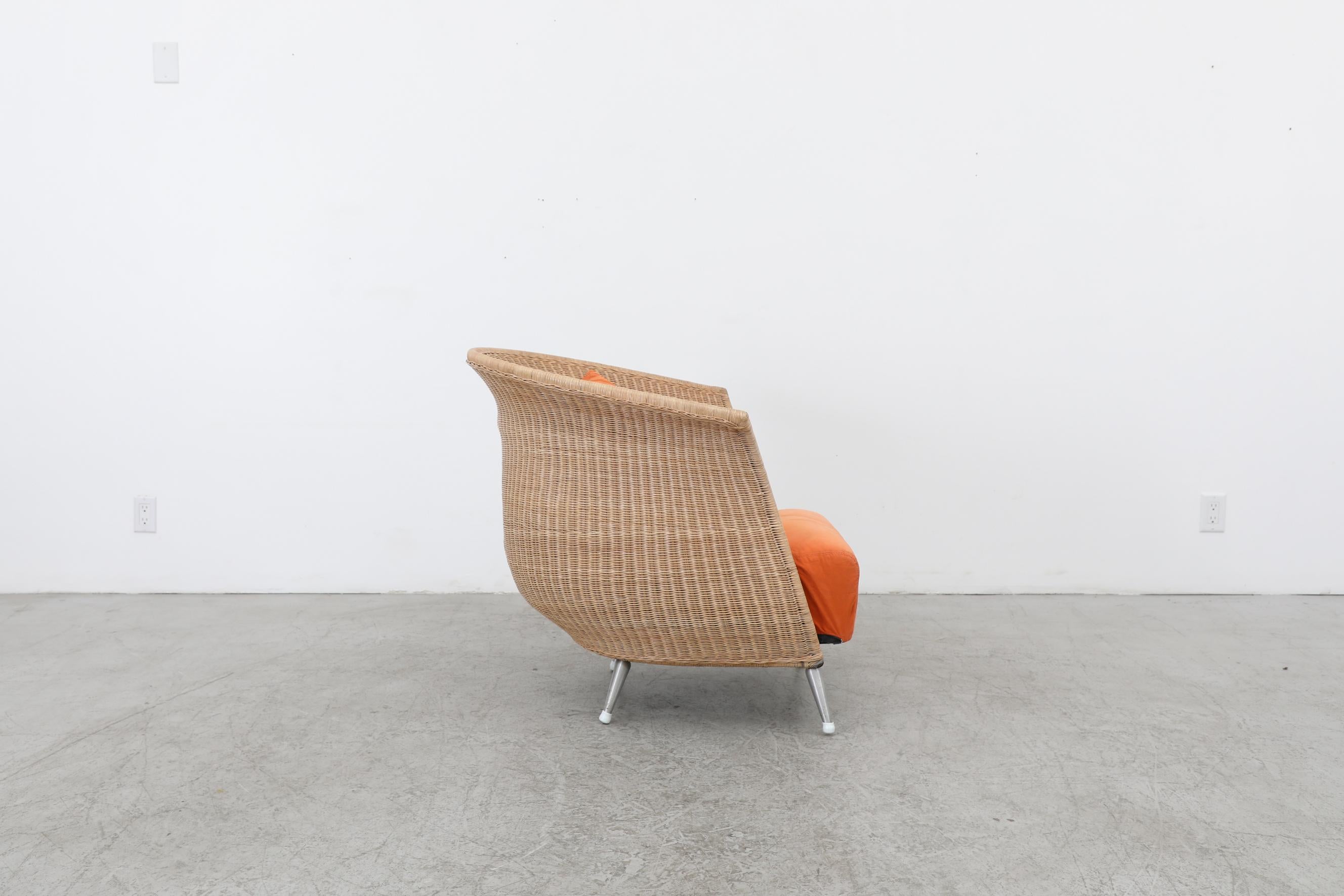 Contemporary Ligne Roset Organic Shaped Rattan Lounge Chair w/ Orange Cushions & Metal Feet For Sale