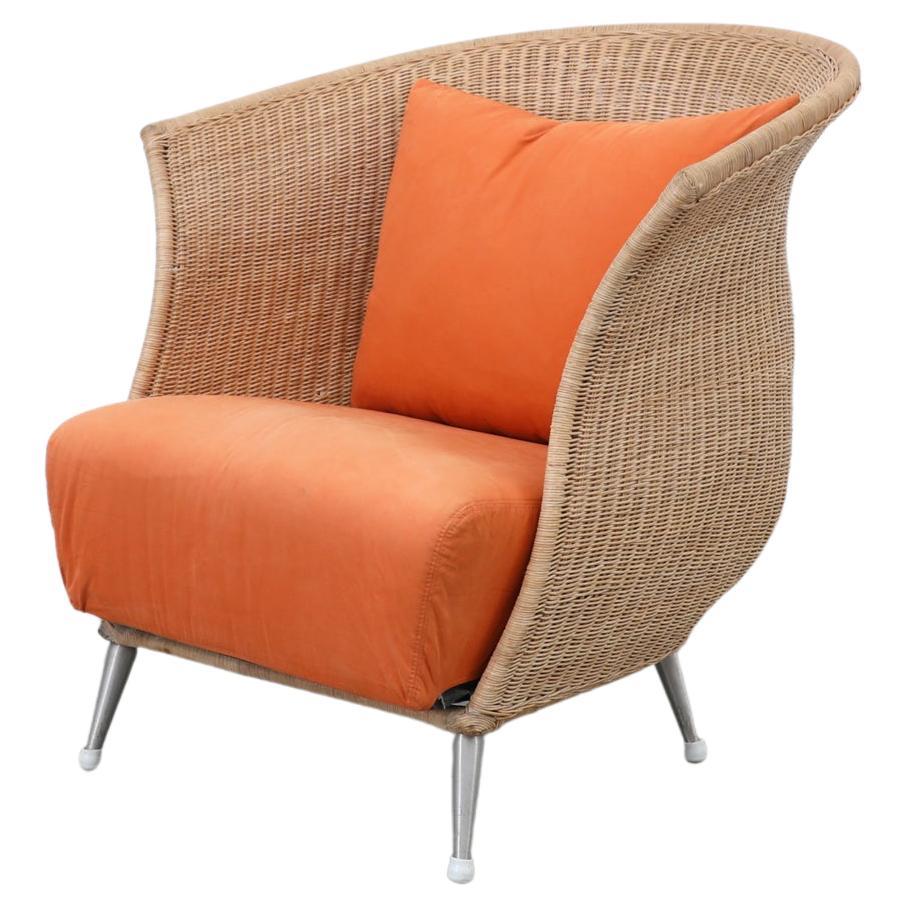 Ligne Roset Rattan Lounge Chair with Orange Cushion