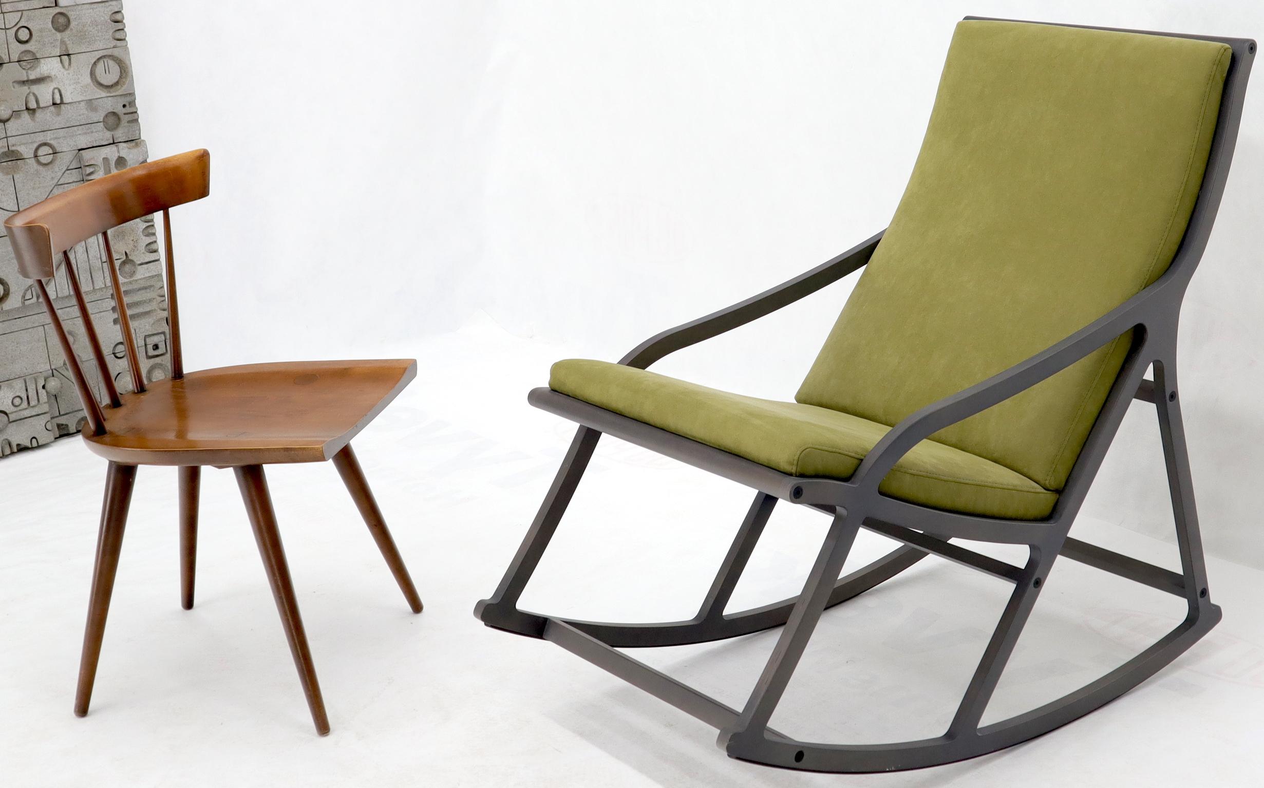 Modernist Mid-Century Modern influence rocking chair in green suede by Ligne Roset. Made in France. Stunning quality craftsmanship.