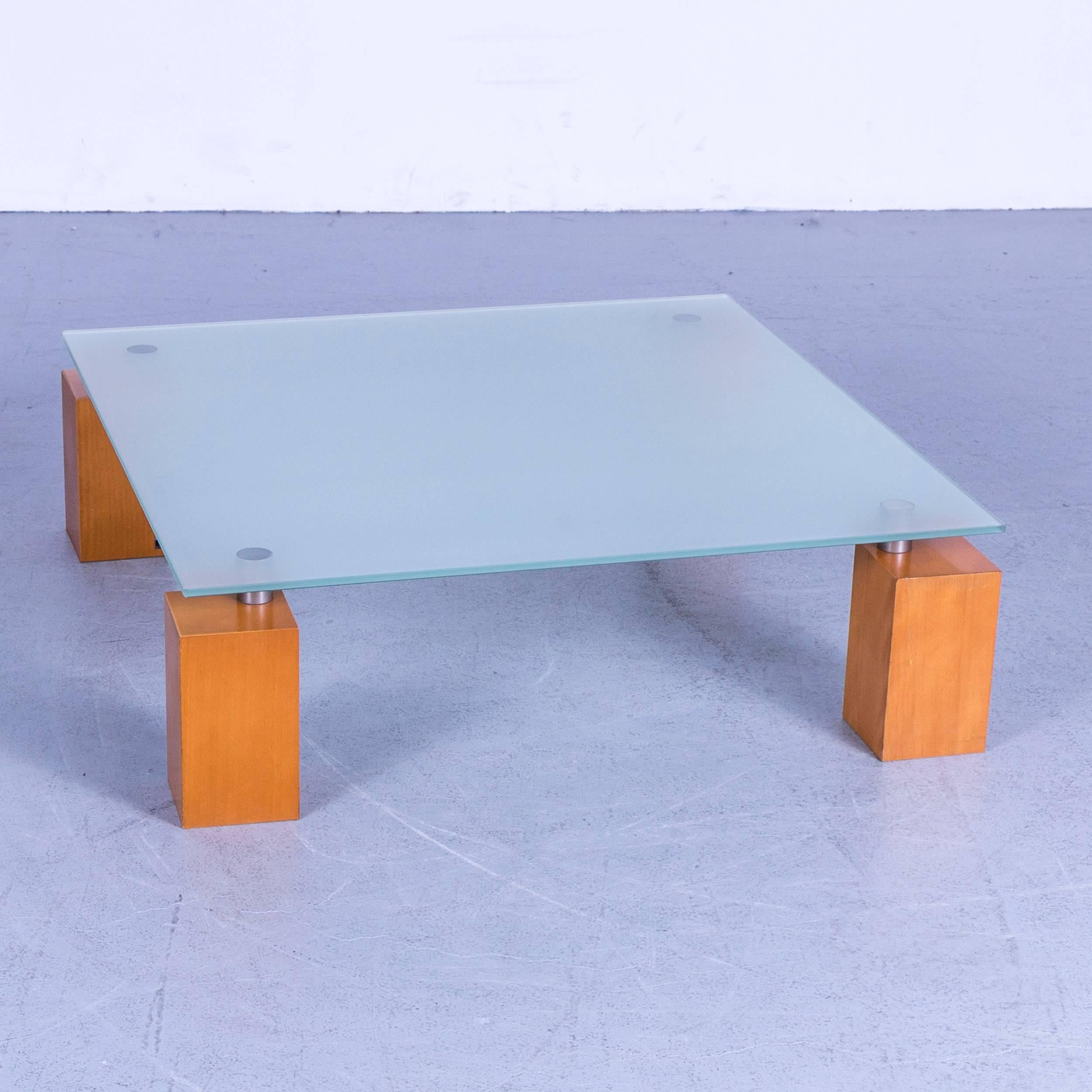 Ligne Roset Squadra coffee table glass top with wooden feed square.