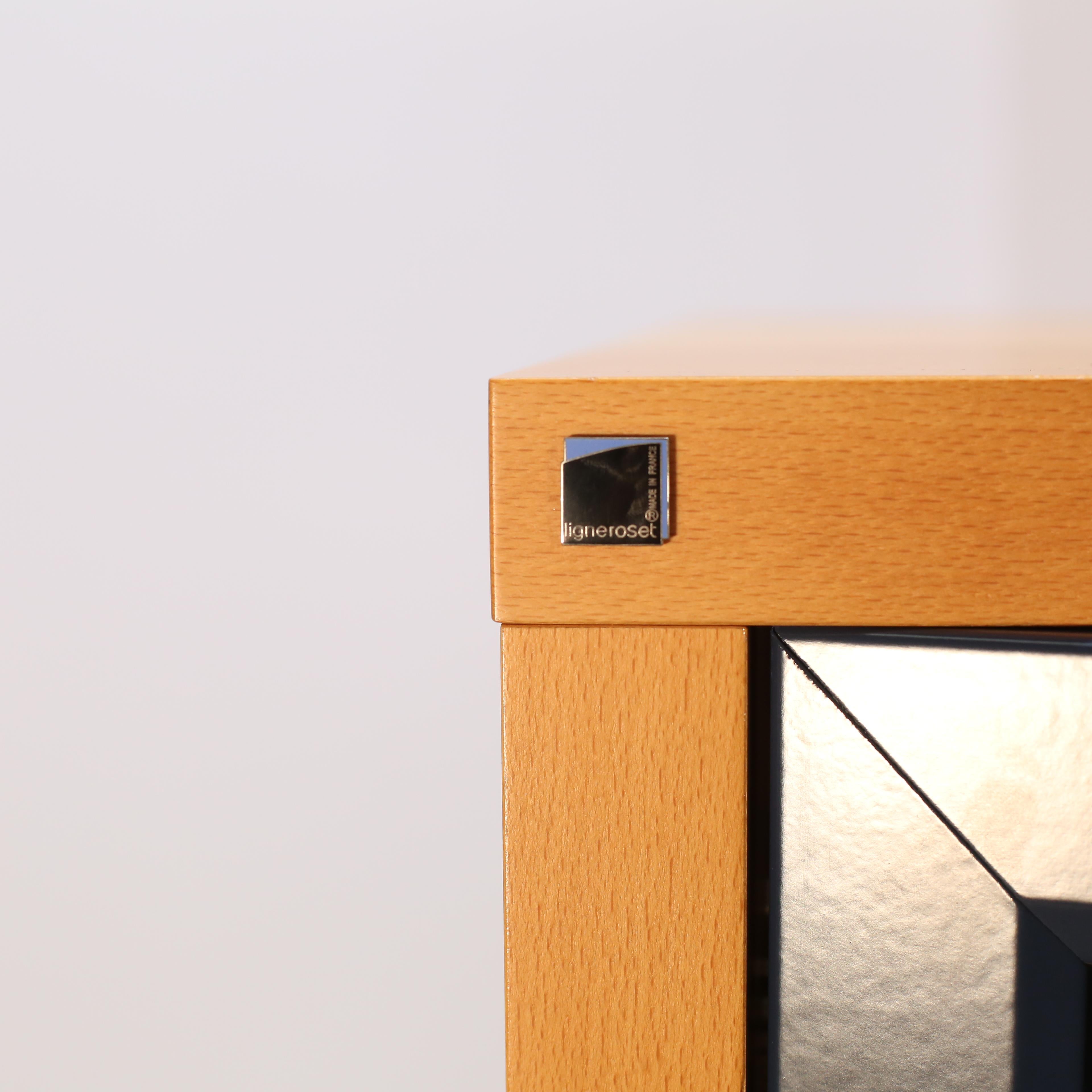 Introducing the stunning Square Display Cabinet by Ligne Roset, a must-have piece for any luxury home. Crafted with impeccable attention to detail, this cabinet features a sleek square design and is made from high-quality materials for durability