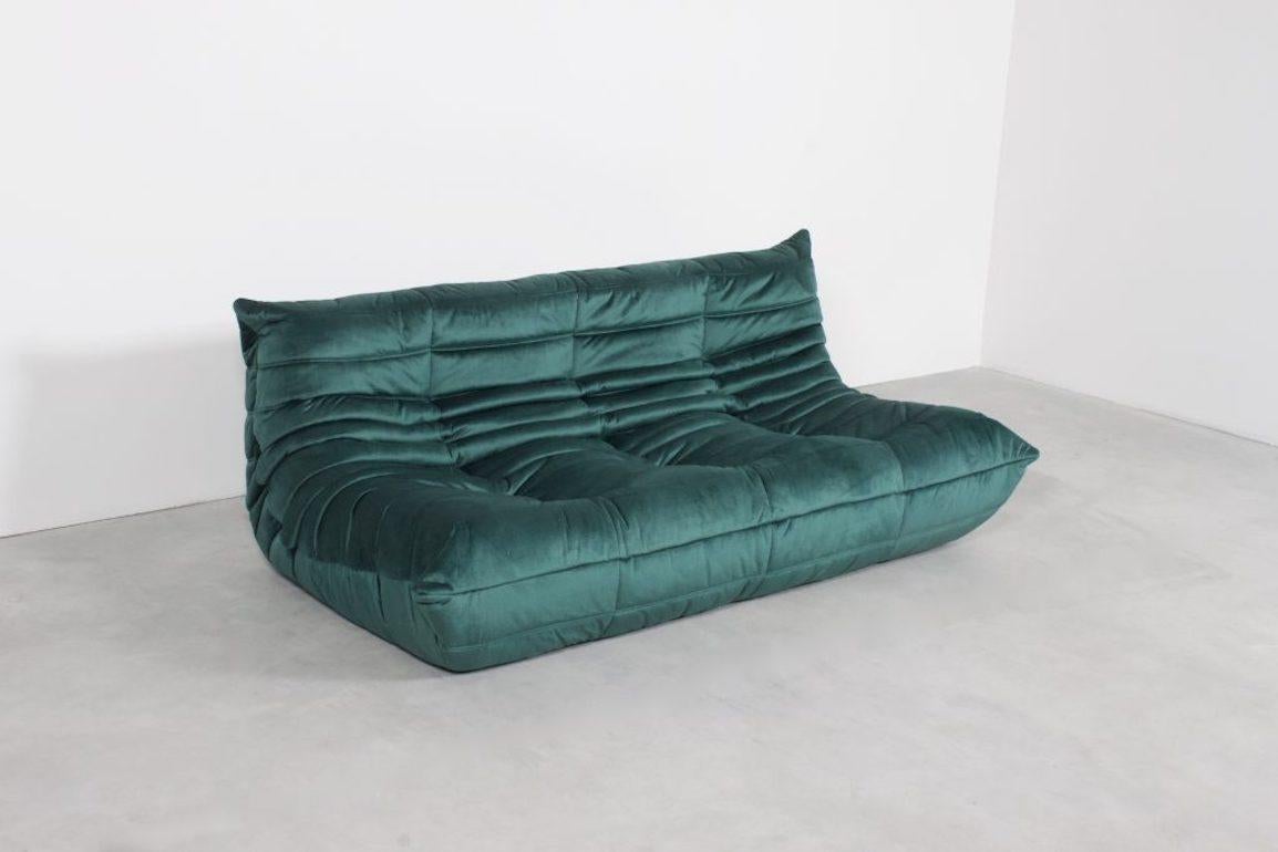 Togo three-seat by Michel Duraroy for Ligne Roset in excellent condition. 

Two sofas available

Reupholstered in a high quality dark green colored velours which gives a beautiful and rich effect.

The Togo features an ergonomic design with