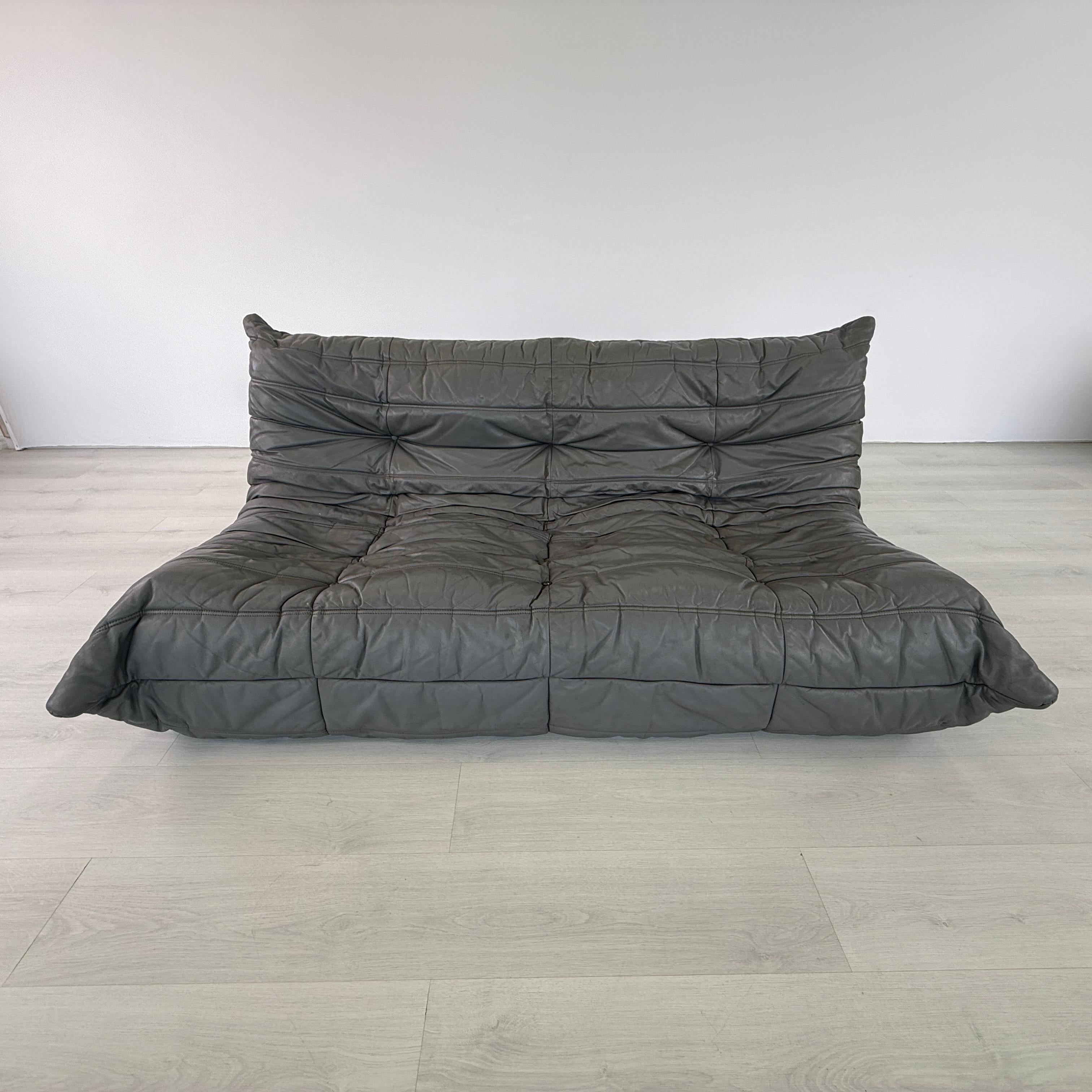 Dimensions: H 27” x W 70” x D 41” x SH 14

Vintage French dark grey leather Ligne Roset “Togo” sofa designed by Michel Ducaroy. Originally designed in the 1970s. Very comfortable and stylish sofa sitting directly on the floor. 


Please see our