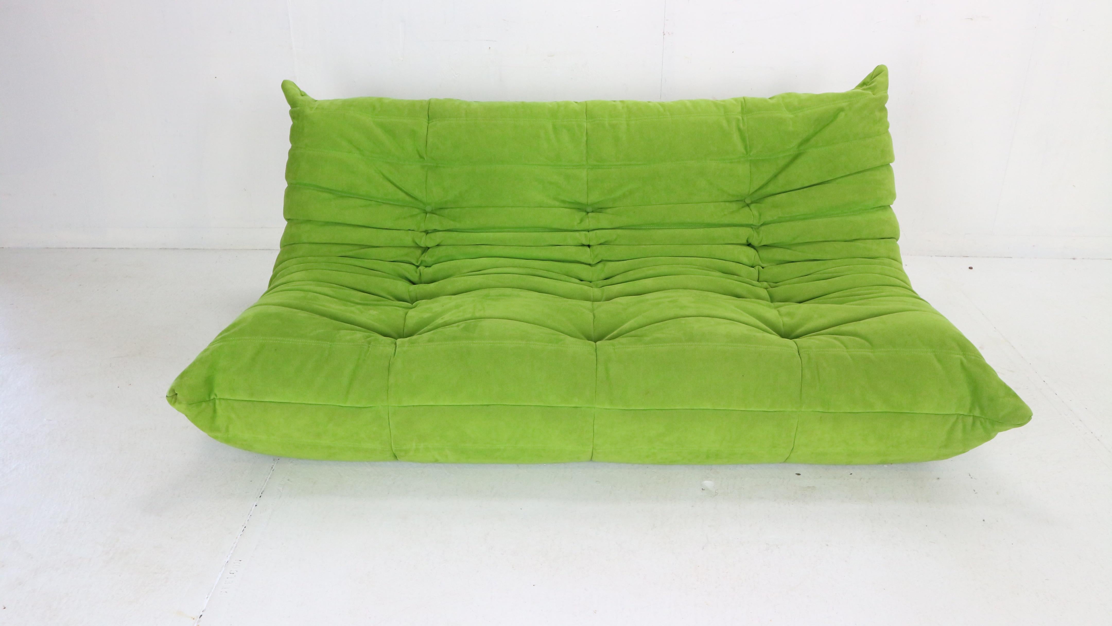 Magnificent Togo three seater lounge sofa designed by Michel Ducaroy in 1973 and was manufactured by Ligne Roset in France.
Very comfortable and beautiful accent to your living room space.
Apple green soft velvet fabric is in a good condition