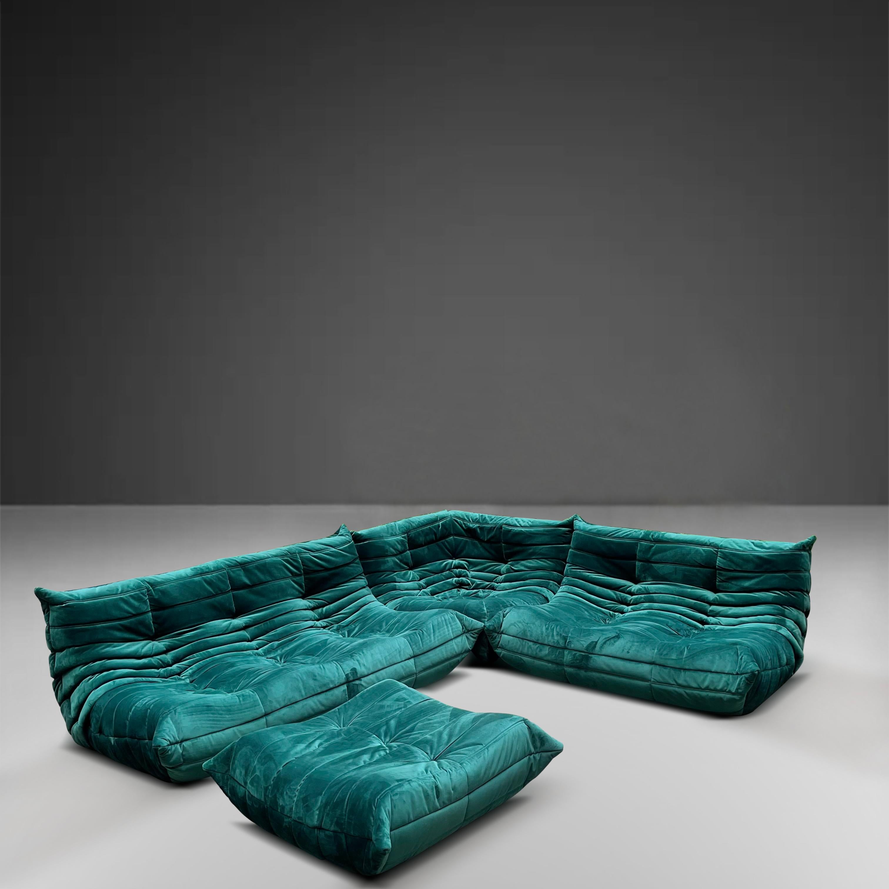Ligne Roset 'Togo' seating group in emerald green velour fabric comes with two sofas one 3-seater and one 2-seater as well as a corner unit and ottoman.